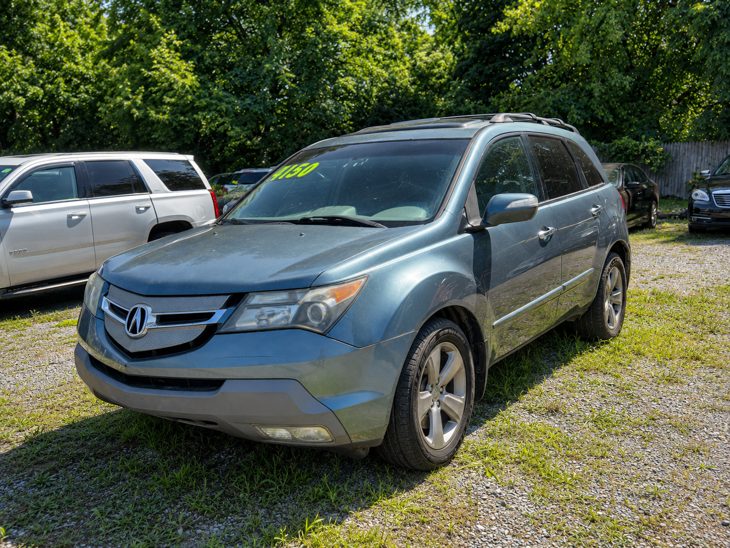 Side profile of a family-friendly blue SUV available at JF Auto Sales