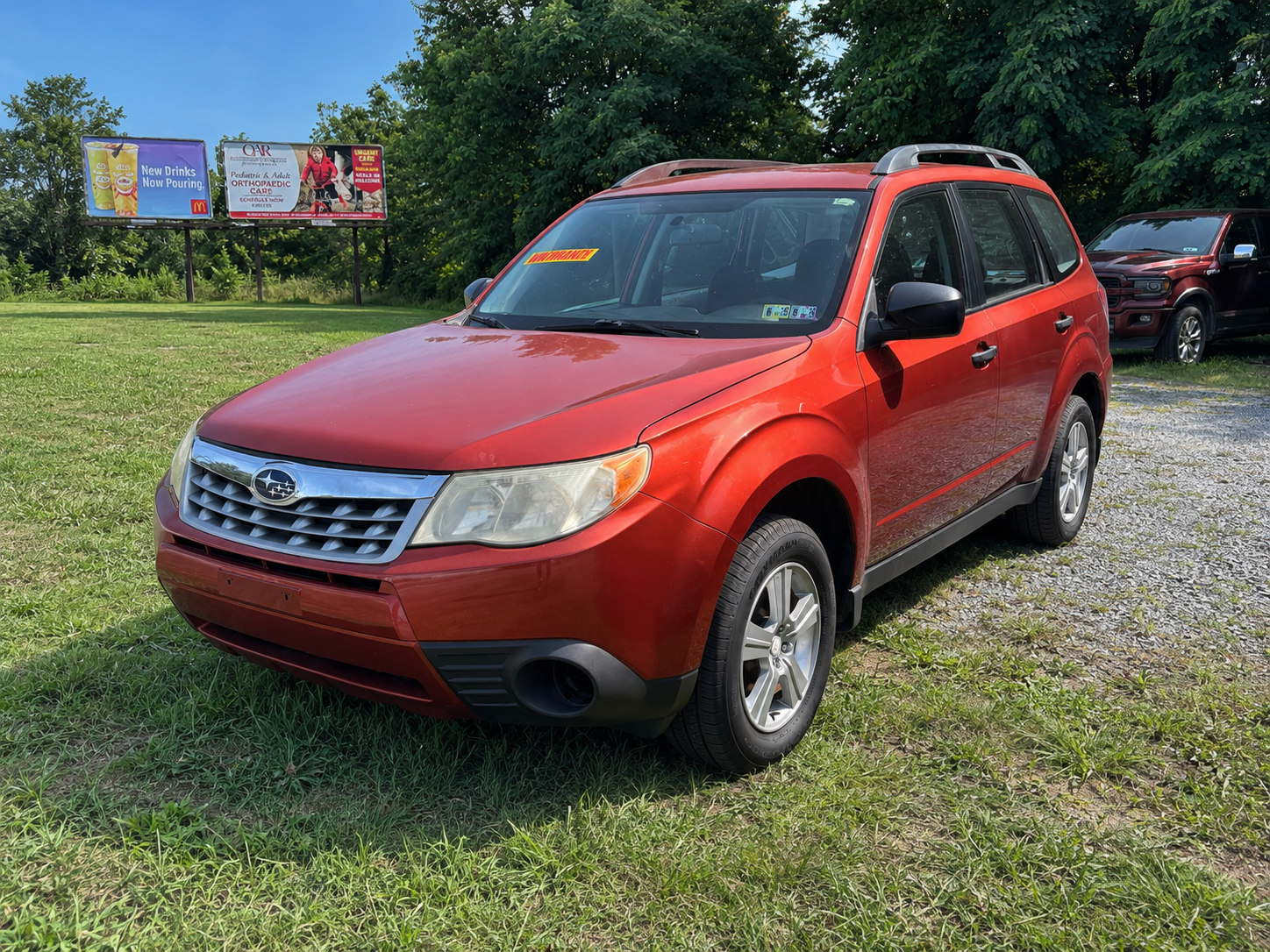 A rugged gray pickup truck for sale parked at JF Auto Sales
