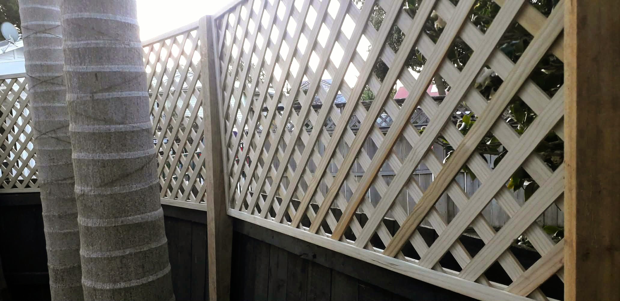 Custom timber garden edging framing raised planter beds and defined lawn borders