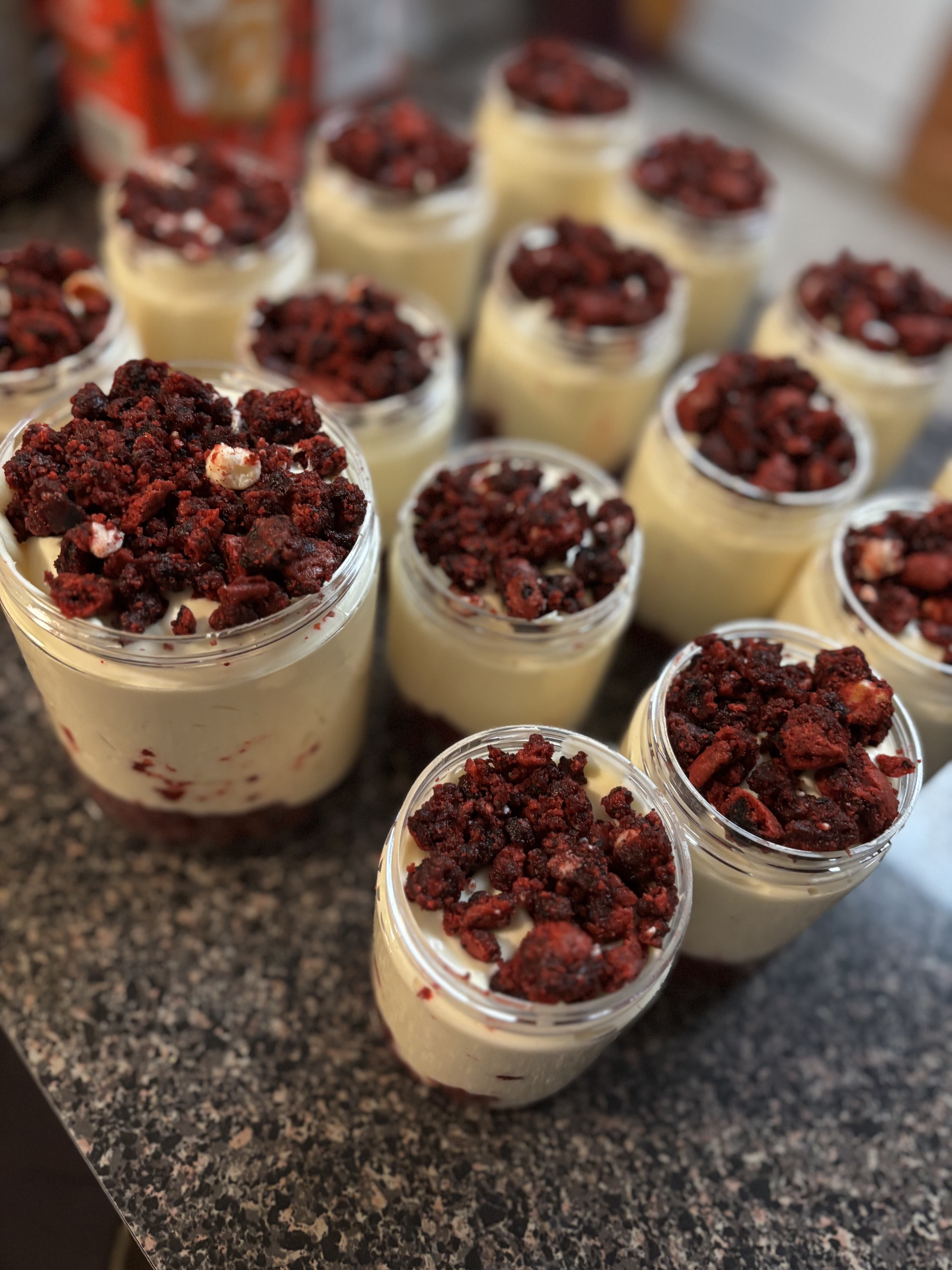 Close-up shot of Oreo pudding with rich chocolate layers and cookie crumbles, served in a modern dessert glass.