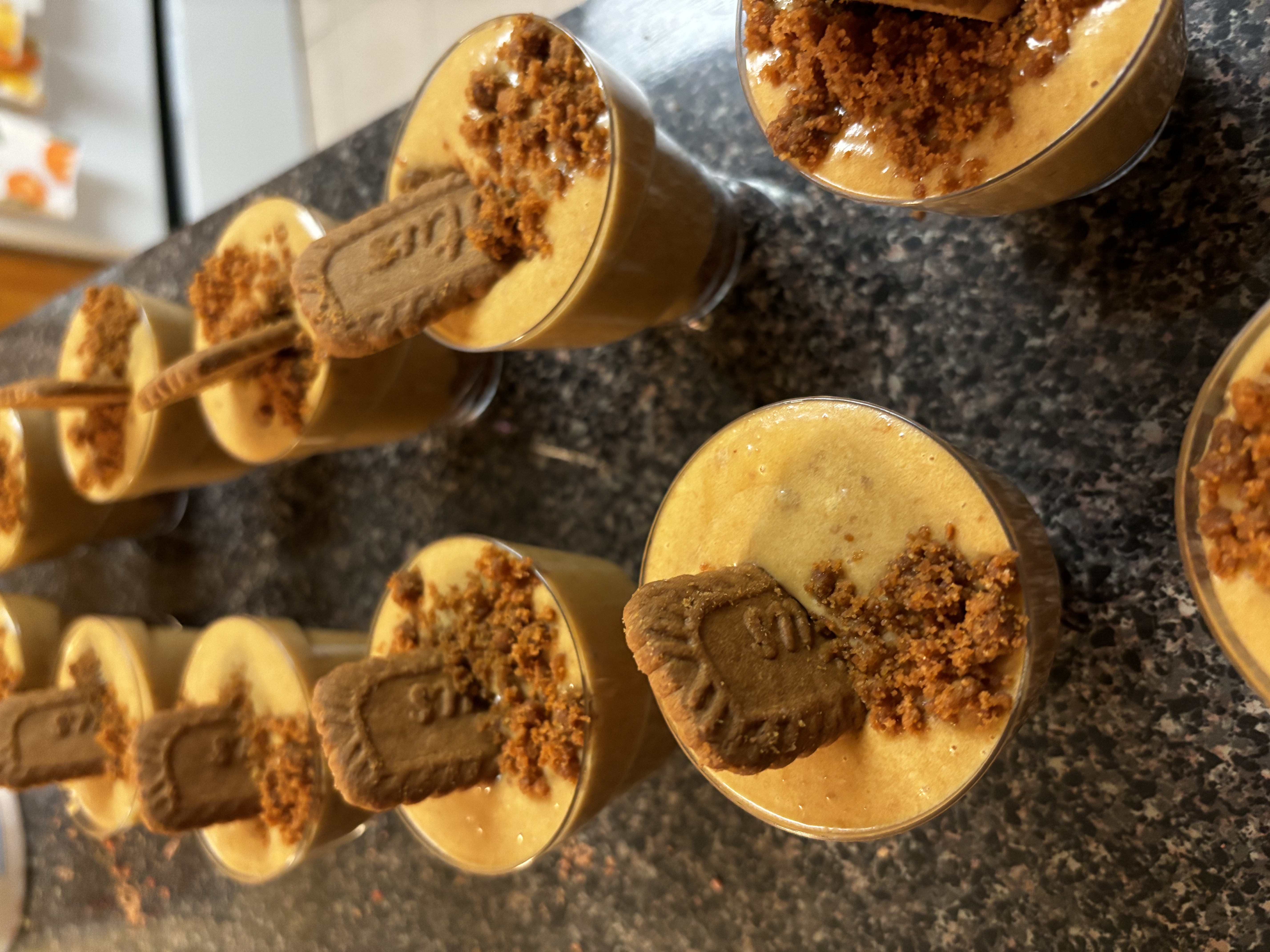 Close up of rich creamy homemade banana pudding layered with vanilla wafers in a glass jar