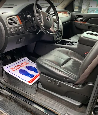 Mirror-like glossy finish on a freshly polished dark car