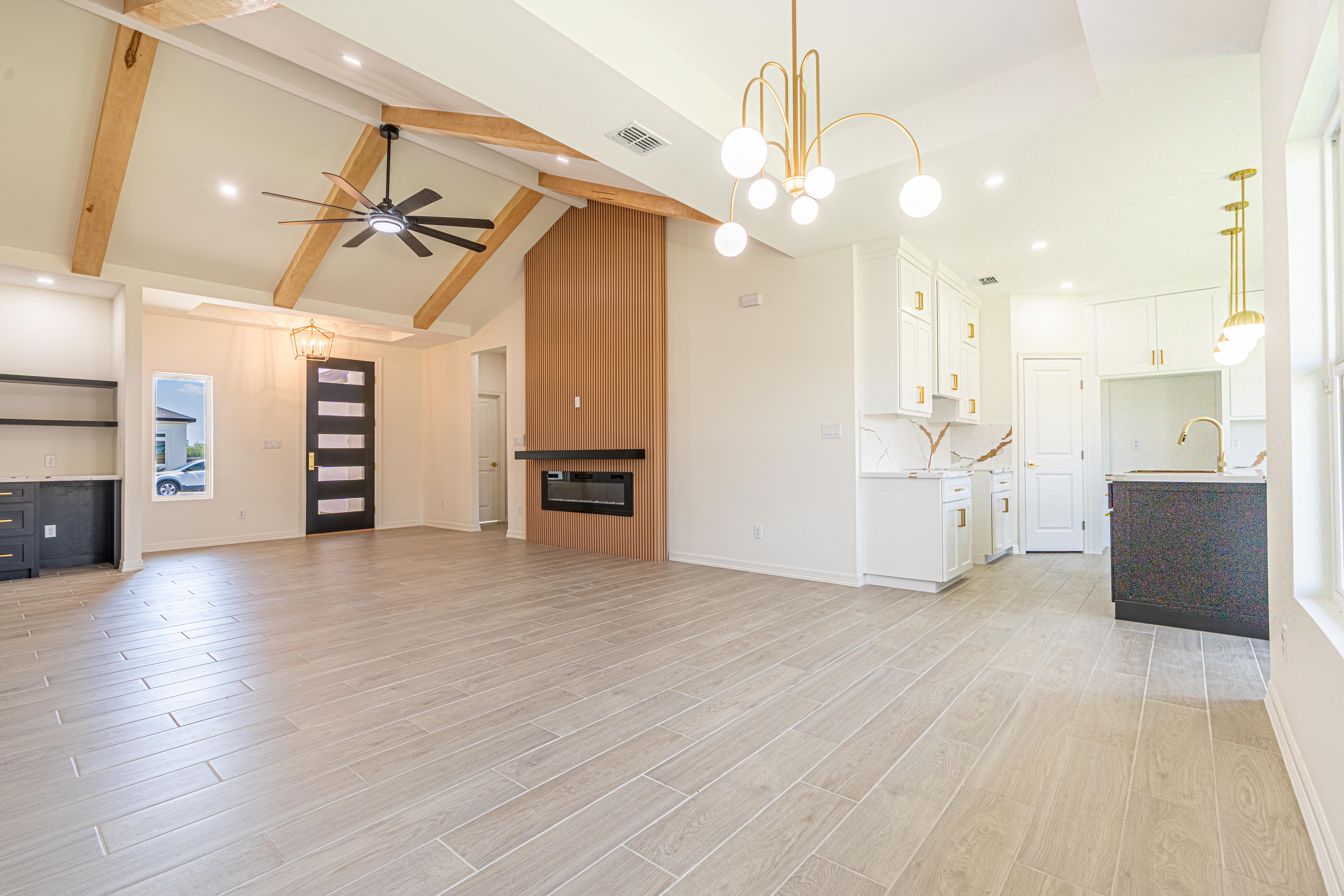 Walk-in pantry with tiered white shelving and tile floor