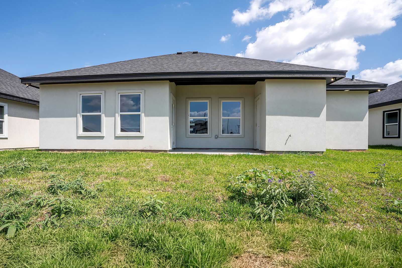 Rear exterior with covered patio view