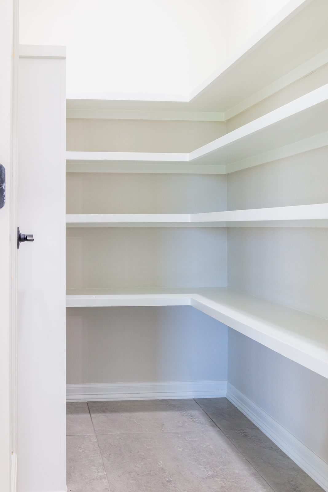 Laundry room with upper cabinets and utility sink
