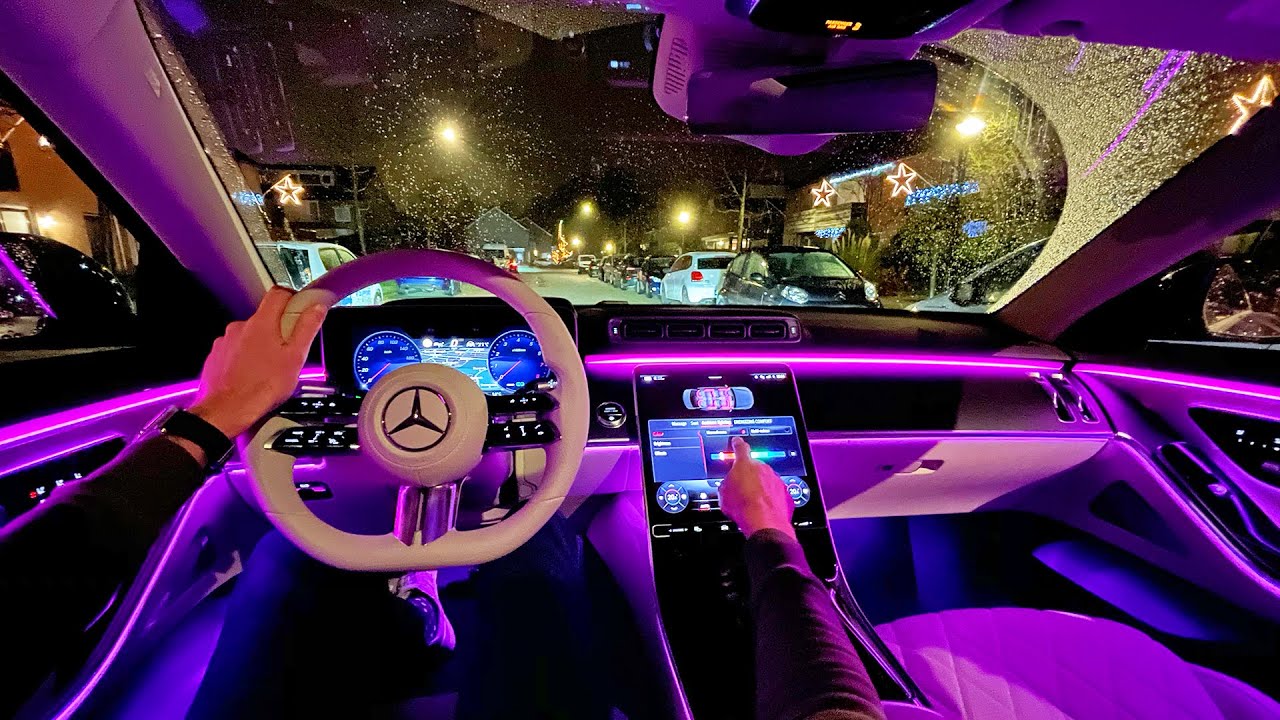 Luxury car interior with premium leather seats, elegant stitching, and modern dashboard showcasing high-end vehicle craftsmanship