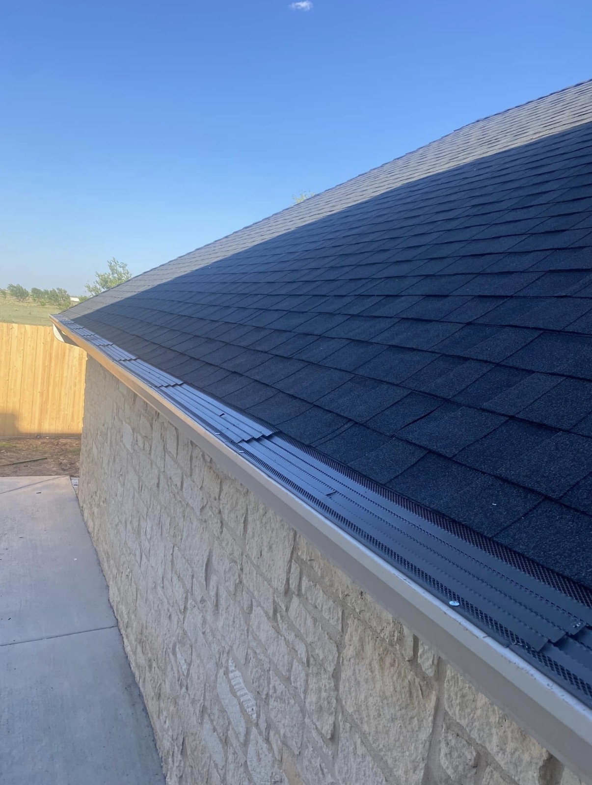 Expert residential roof installation on a modern suburban home