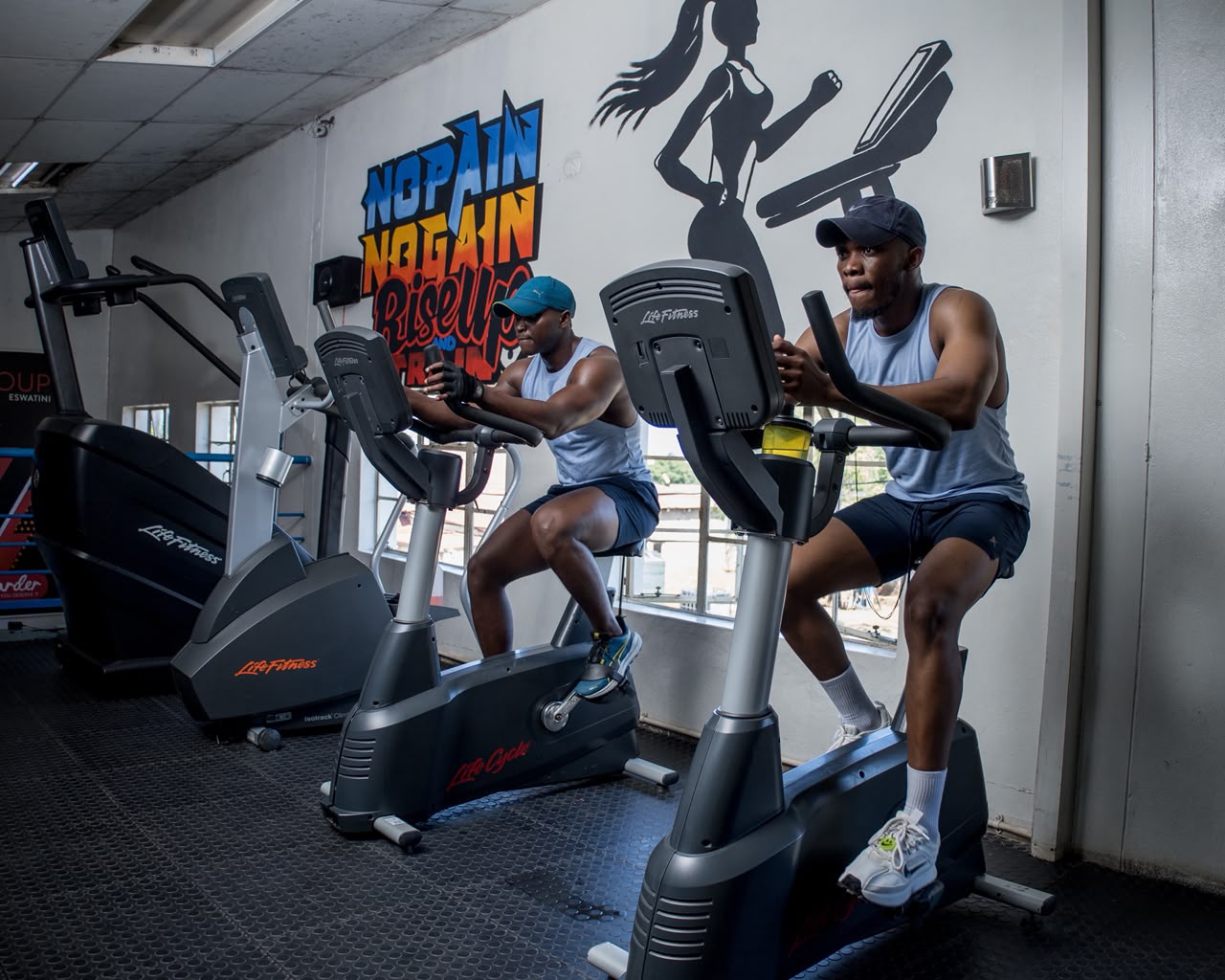 Group fitness class in a high-energy session at The Fitness Zone