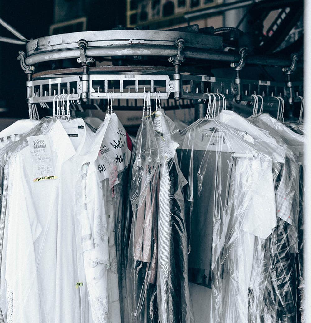 Close-up of premium fabric swatches with measuring tape and tailoring tools