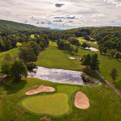 Elegant Liquid Sky Rentals townhome exterior with stone facade overlooking the Sand Springs golf course community in Drums Pennsylvania