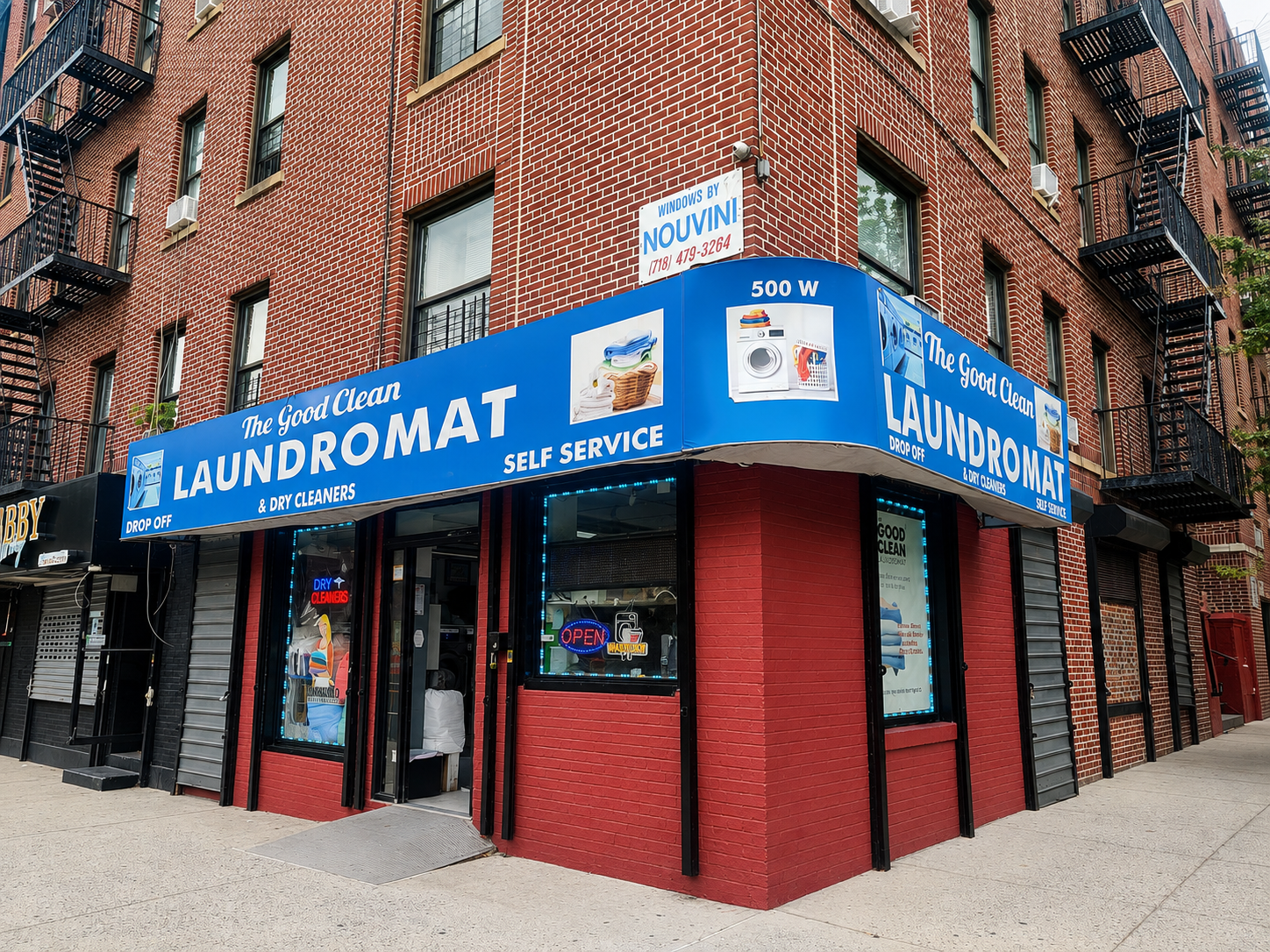 Family owners standing proudly in their newly renovated Washington Heights laundromat