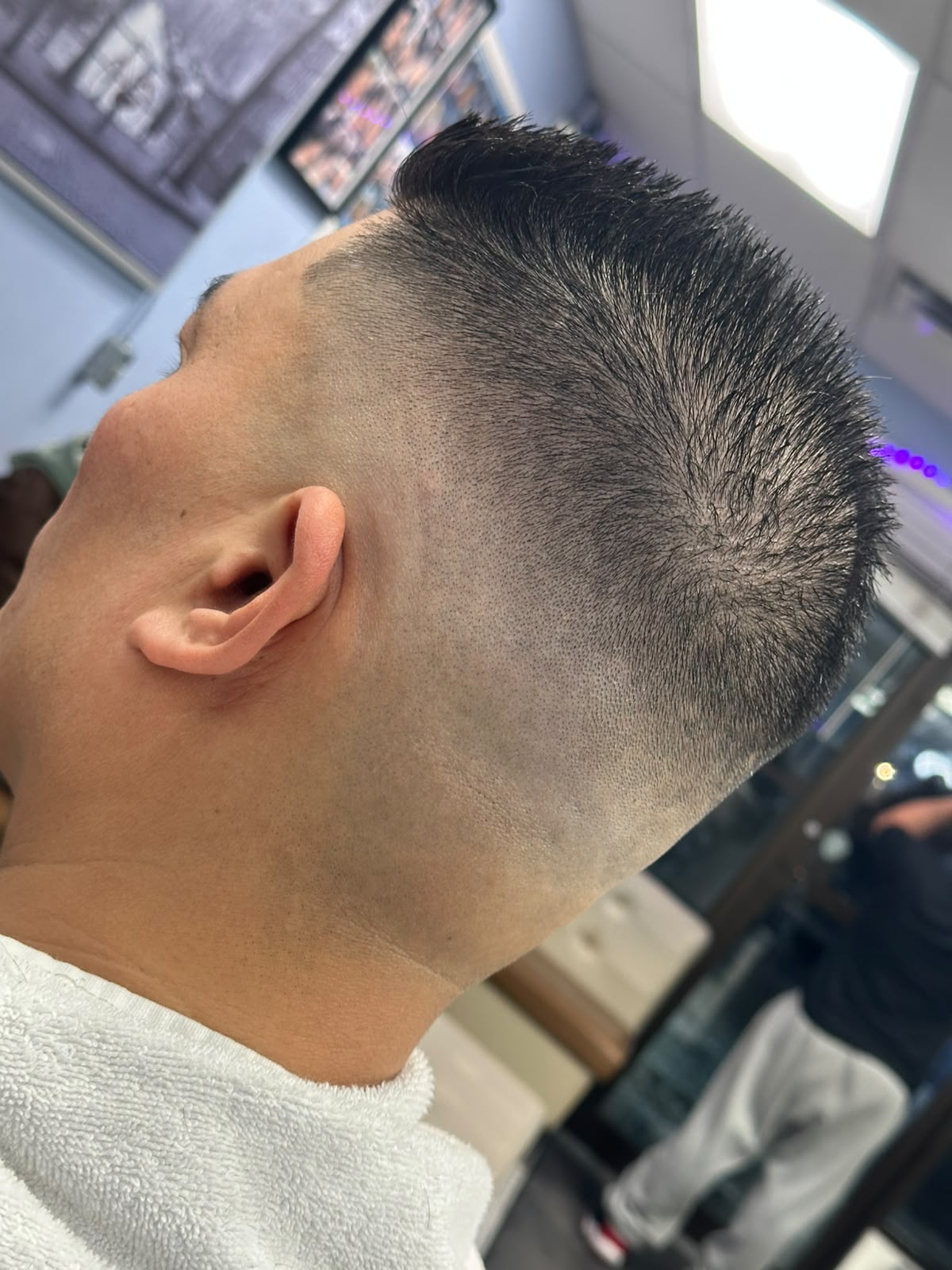 Clean military buzz cut with sharp edge up at Ambassador Barber Shop Calgary