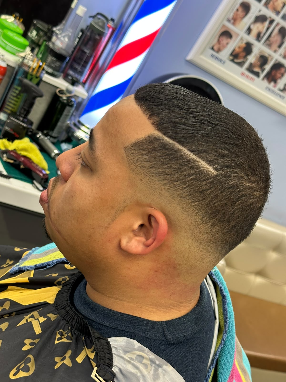 Modern quiff hairstyle with volume and side fade at Ambassador Barber Shop Calgary