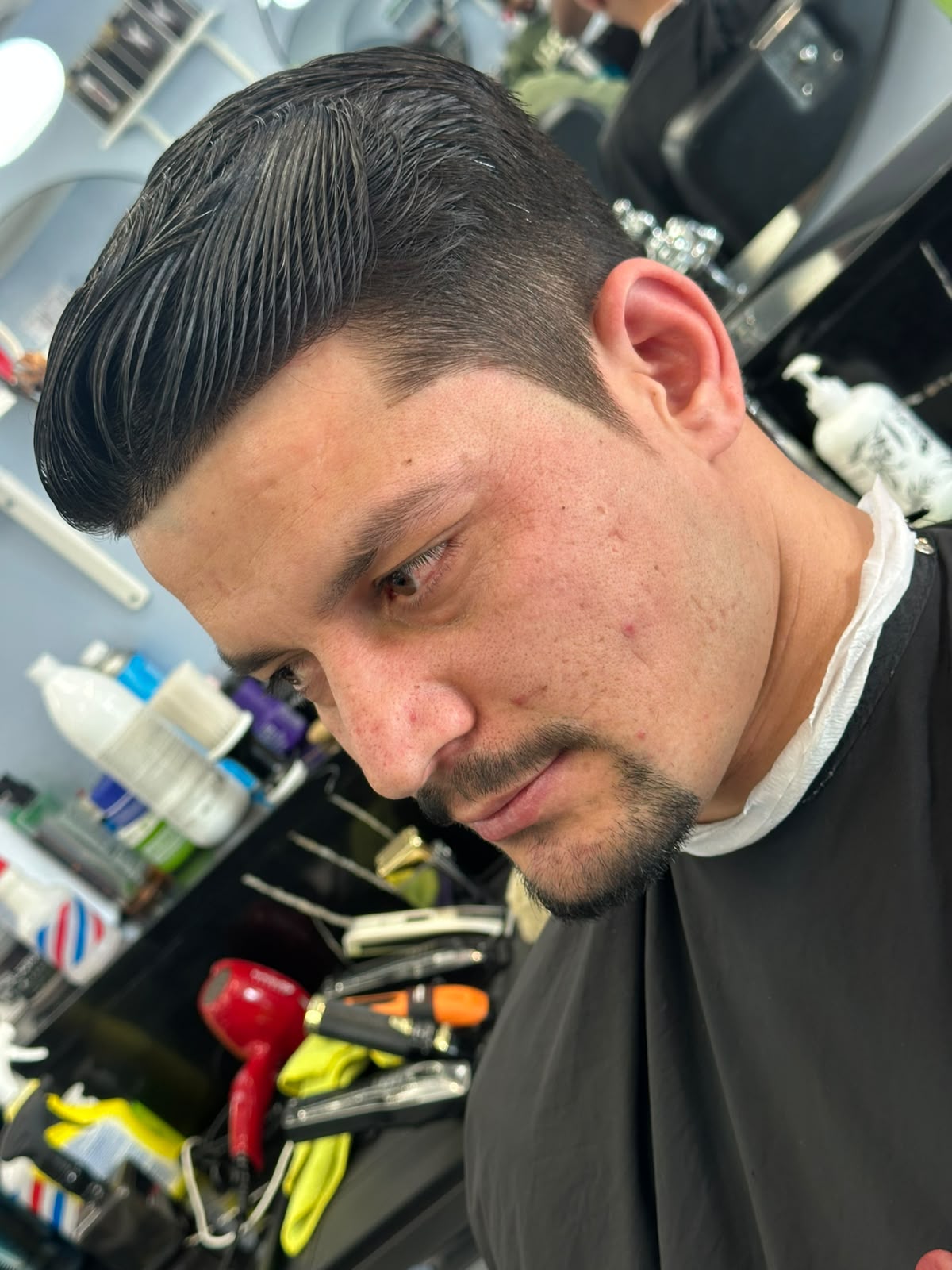 Sharp disconnected undercut with long top at Ambassador Barber Shop Calgary