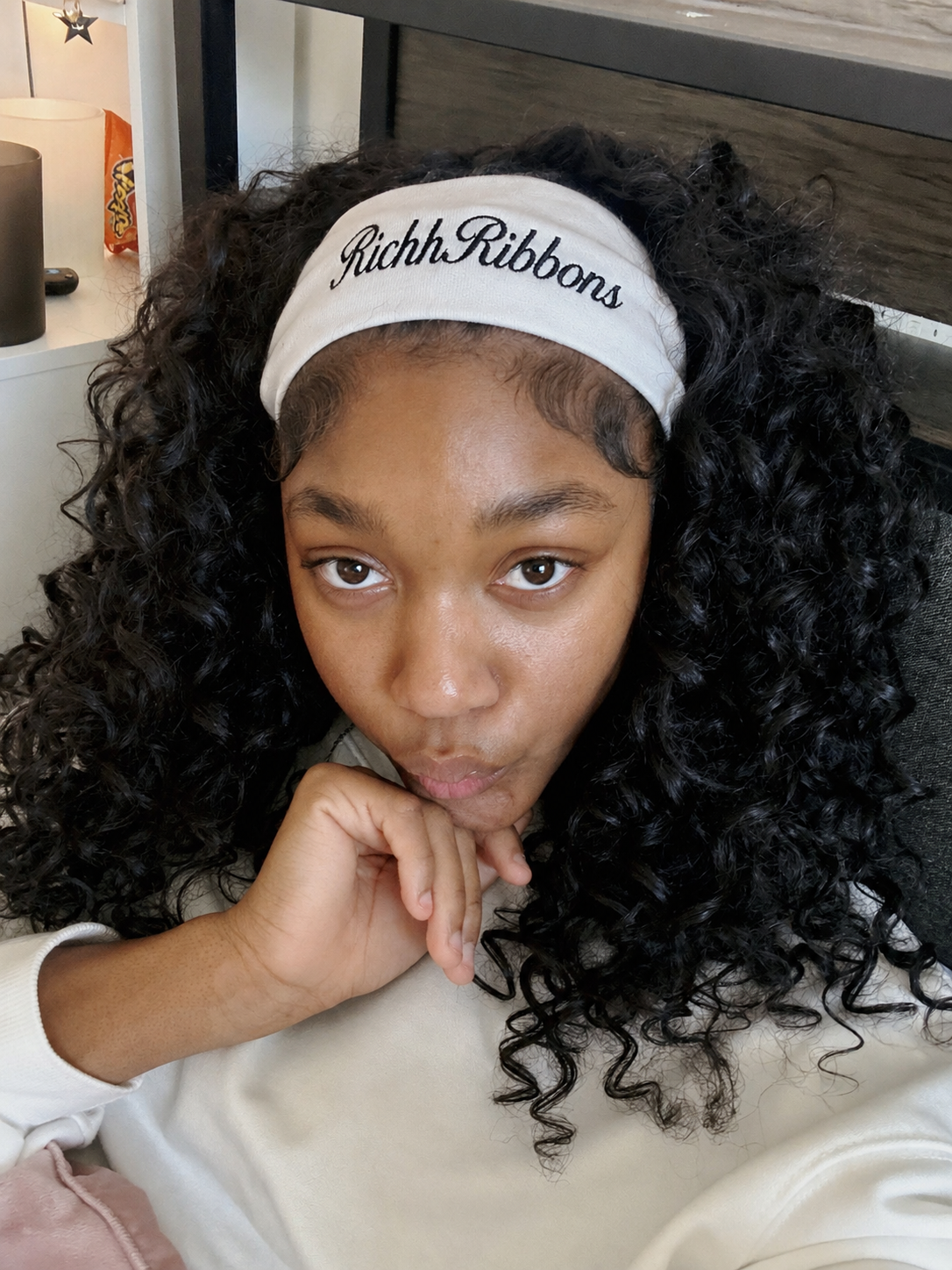 Black girl wearing a plain white headband with no bow, soft angelic lighting