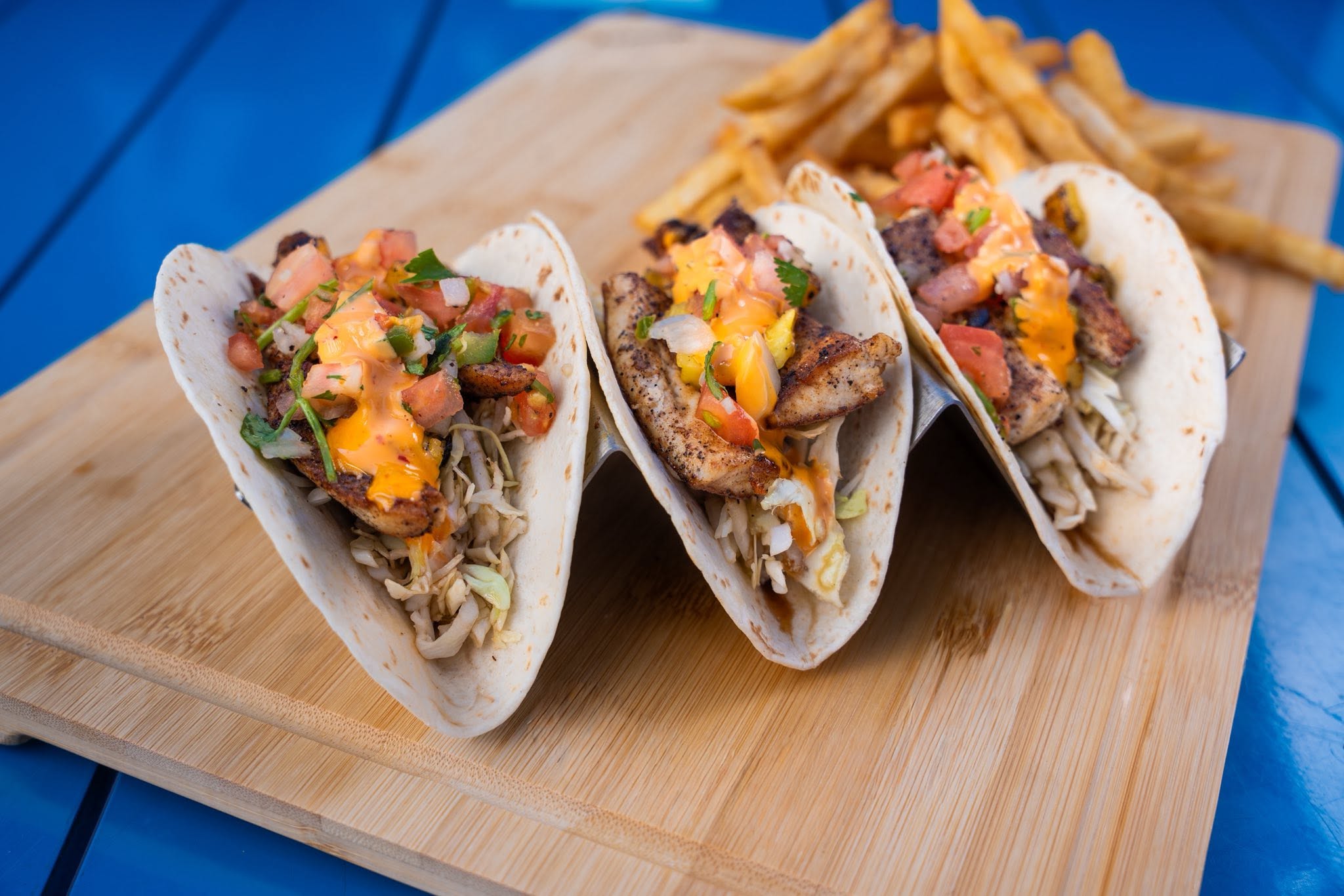 Platter of freshly made blackened fish tacos with mango salsa