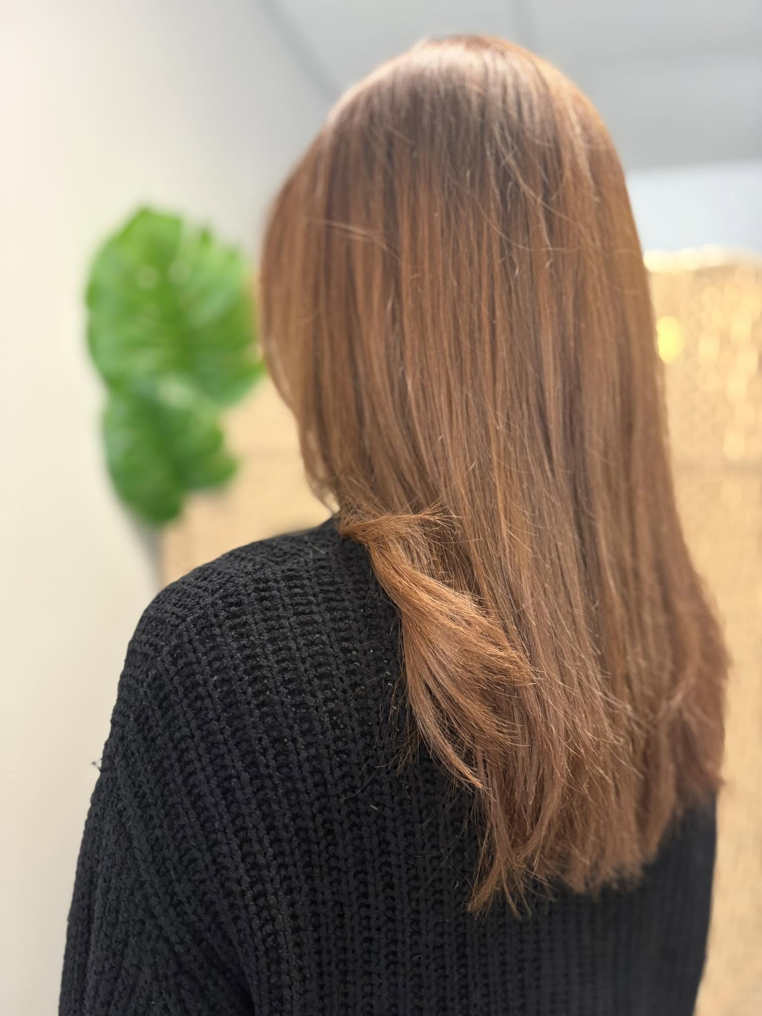 Before and after of a client's stunning balayage hair transformation