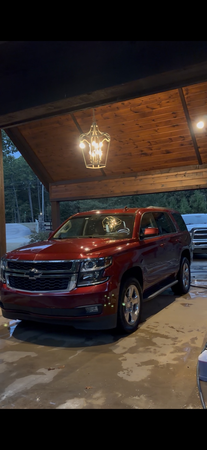 Freshly detailed luxury car with a flawless, glossy paint finish showing premium auto detailing results