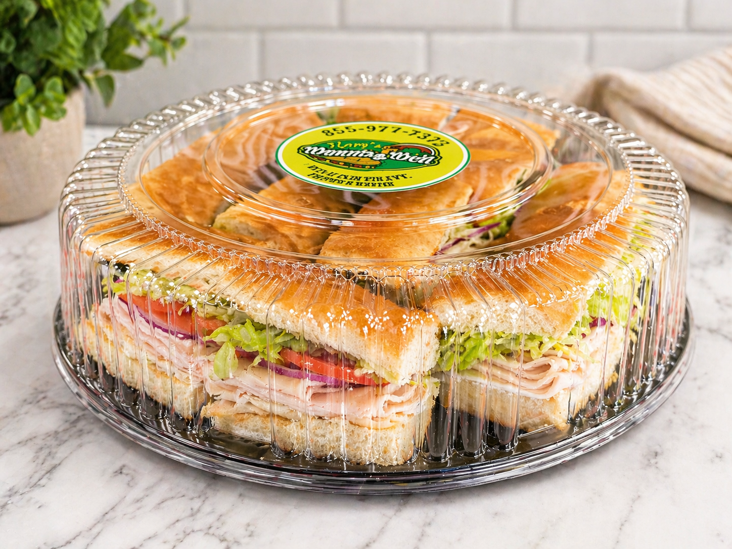 Oven-roasted turkey sandwich with fresh lettuce, tomato, and cheese on freshly baked bread