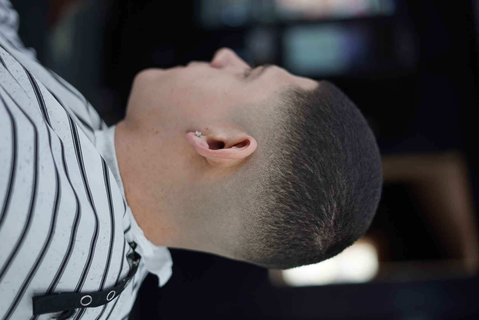 Sharp skin fade with crisp lineup expertly executed at Blessed VIP Cutz