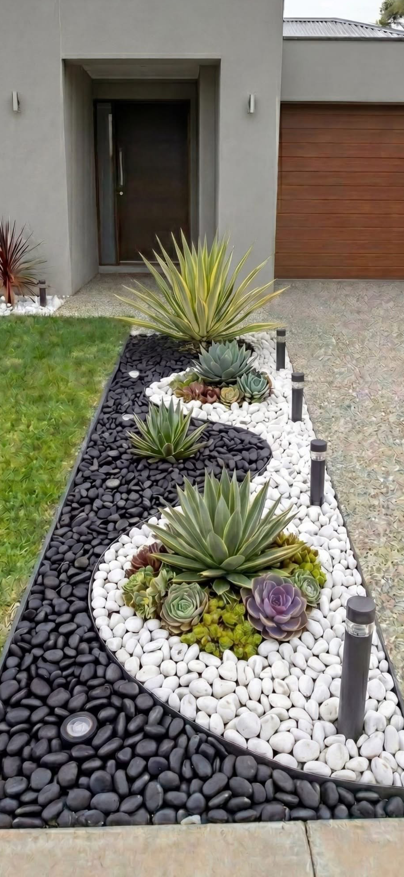 Freshly mulched garden bed with dark brown mulch surrounding ornamental shrubs