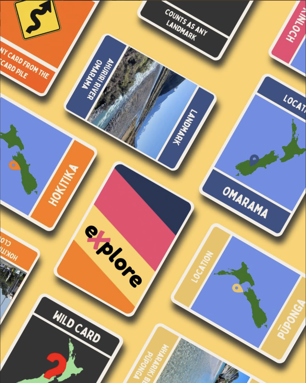 Young travellers holding eXplore Aotearoa cards while exploring a scenic New Zealand landscape with mountains and native bush