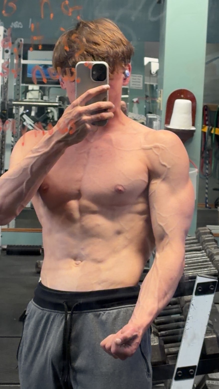 Dedicated gym member lifting heavy weights and achieving fitness goals