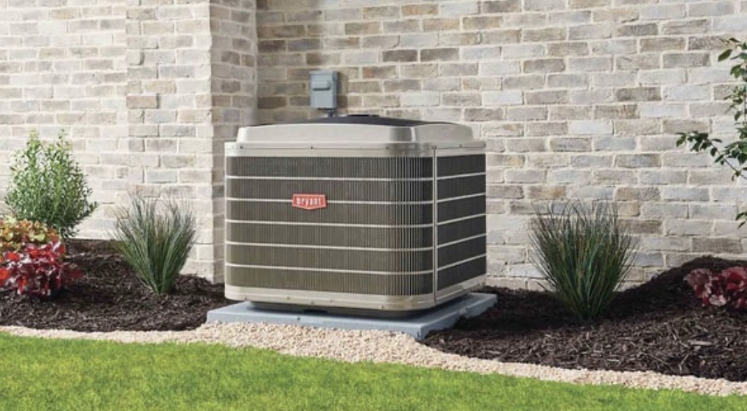 High-efficiency Bryant heat pump unit installed outside a modern home