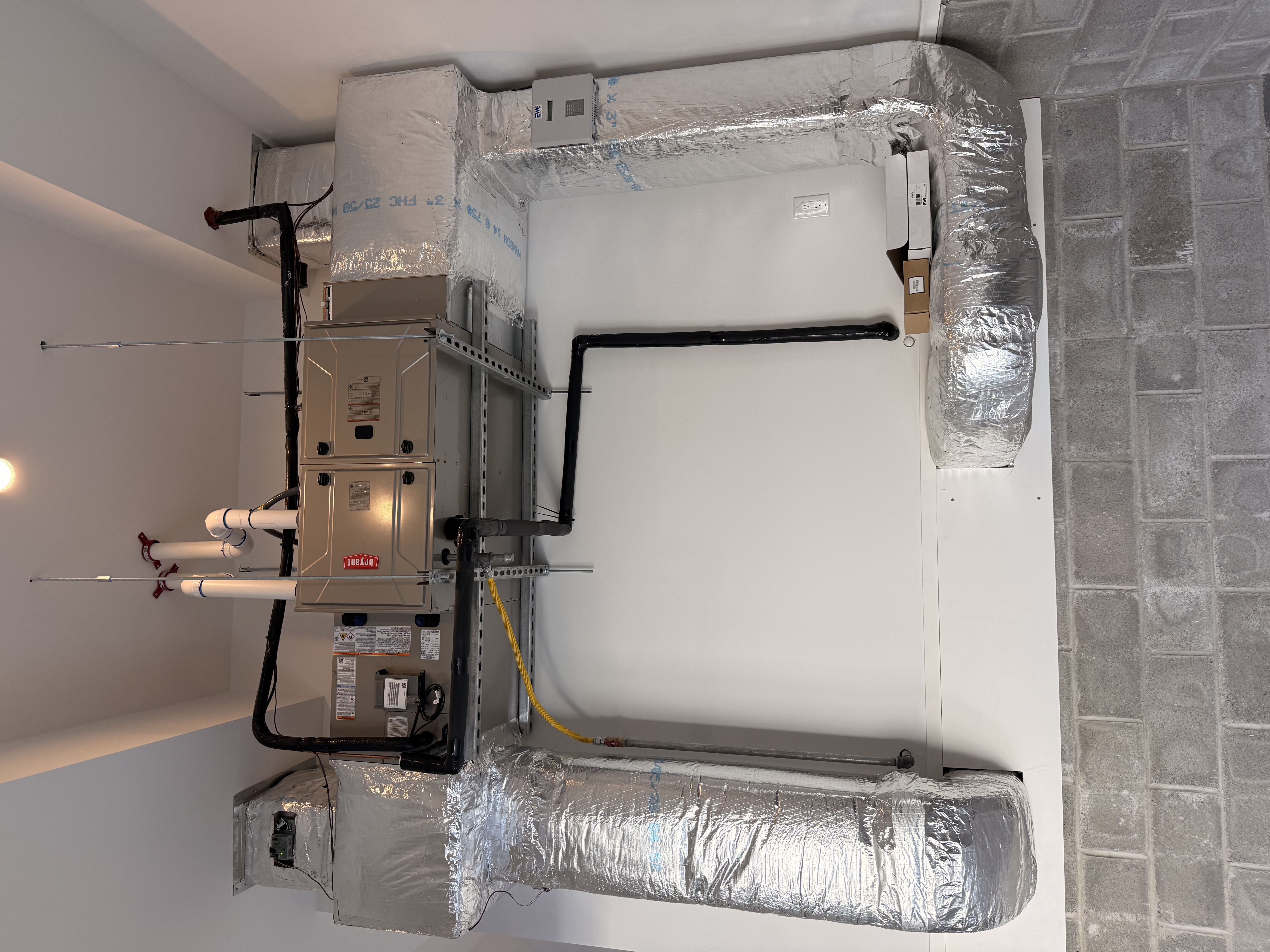 Professional furnace installation in residential basement