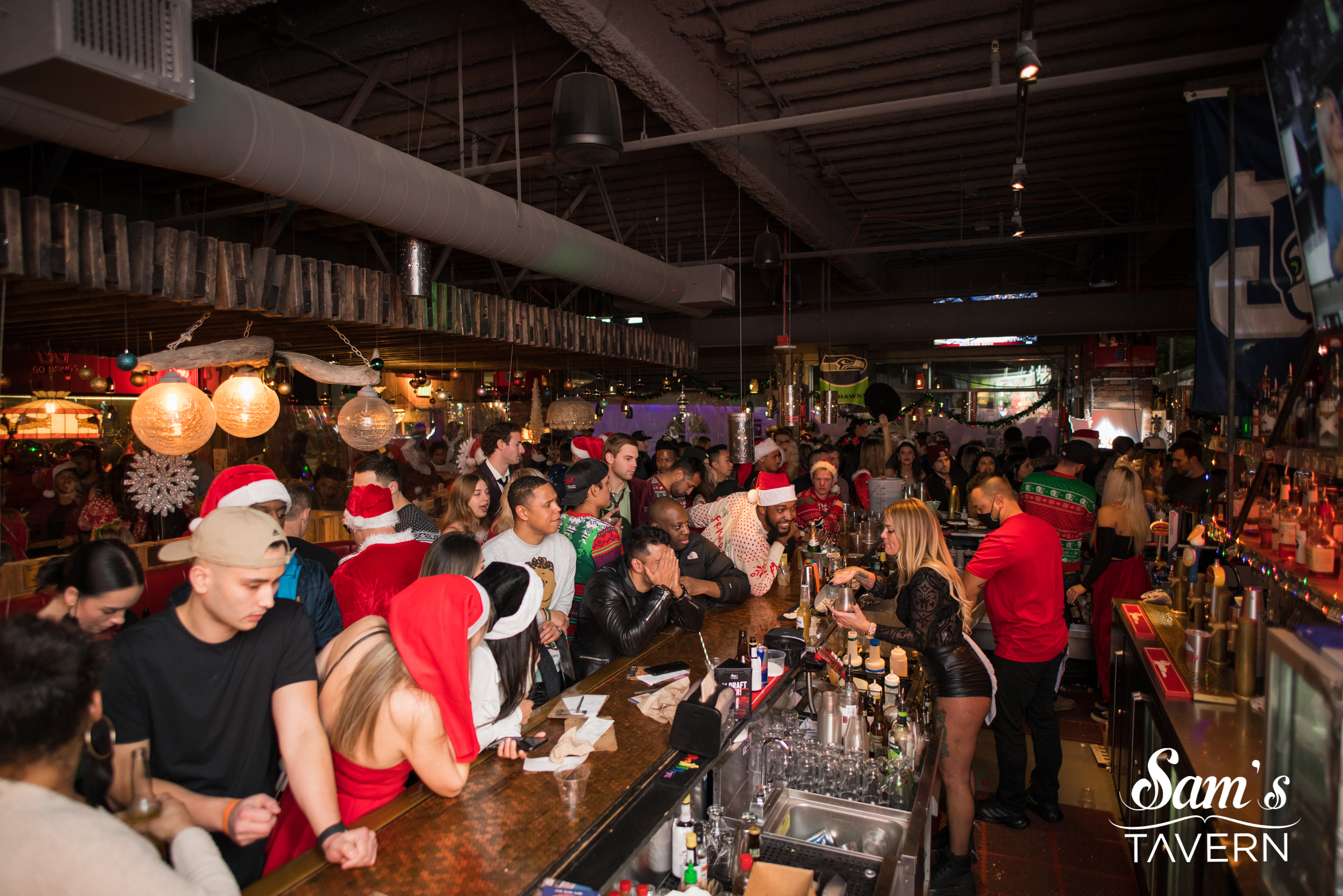 Packed bar crowd enjoying a high-energy nightlife event