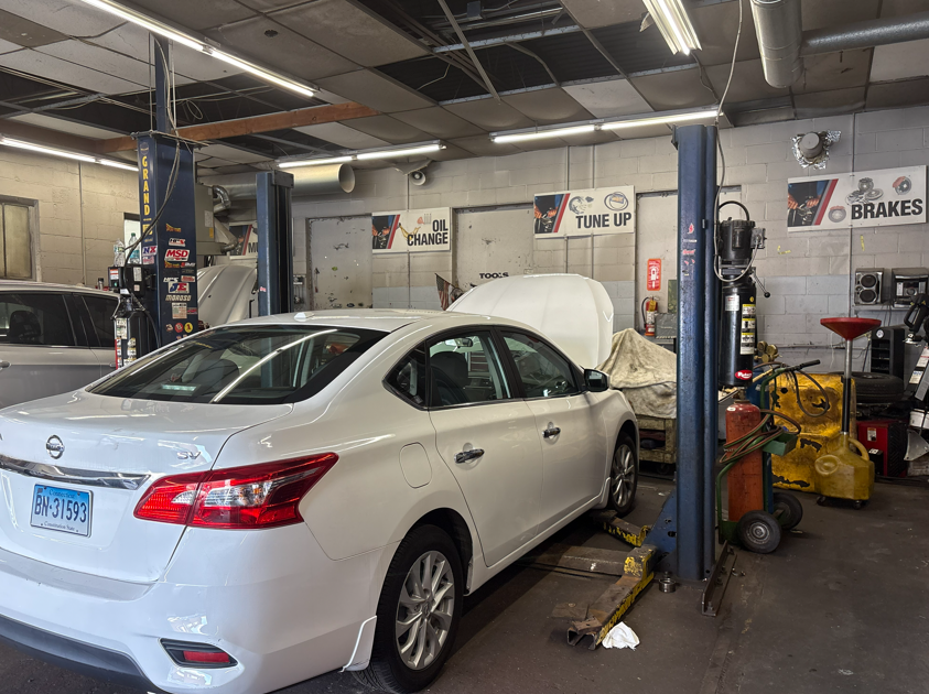 Spacious C&F Automotive shop interior featuring multiple service bays and lifts in Hartford