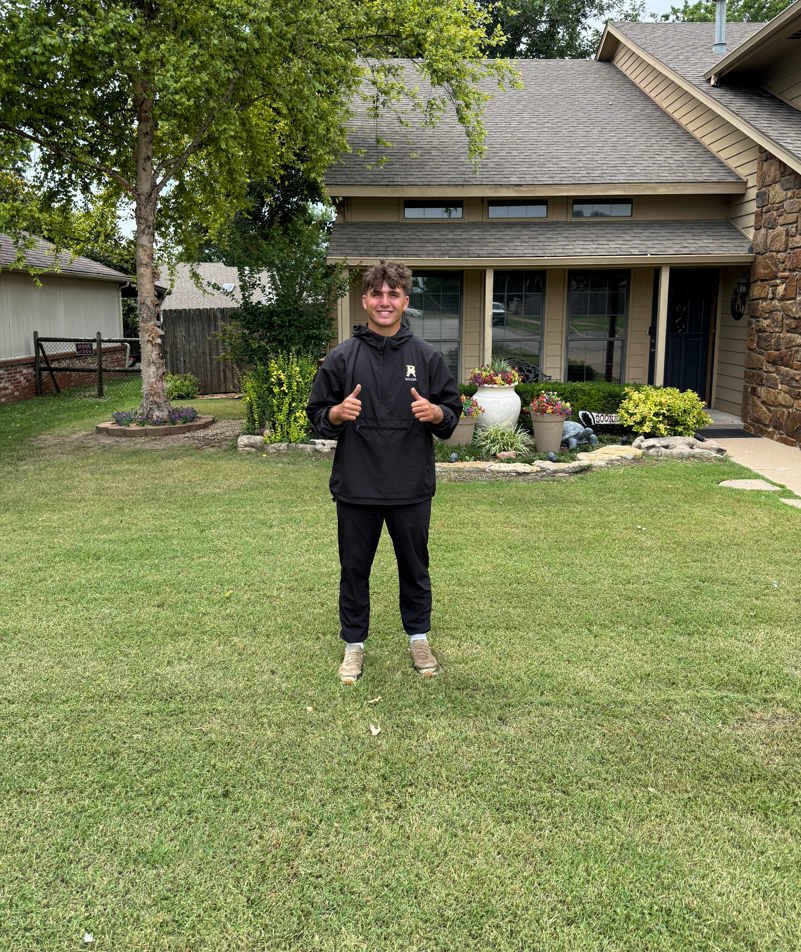 Gavin Dill, 19-year-old owner of Dill's Lawn Care, standing confidently with professional lawn equipment in Broken Arrow, Oklahoma