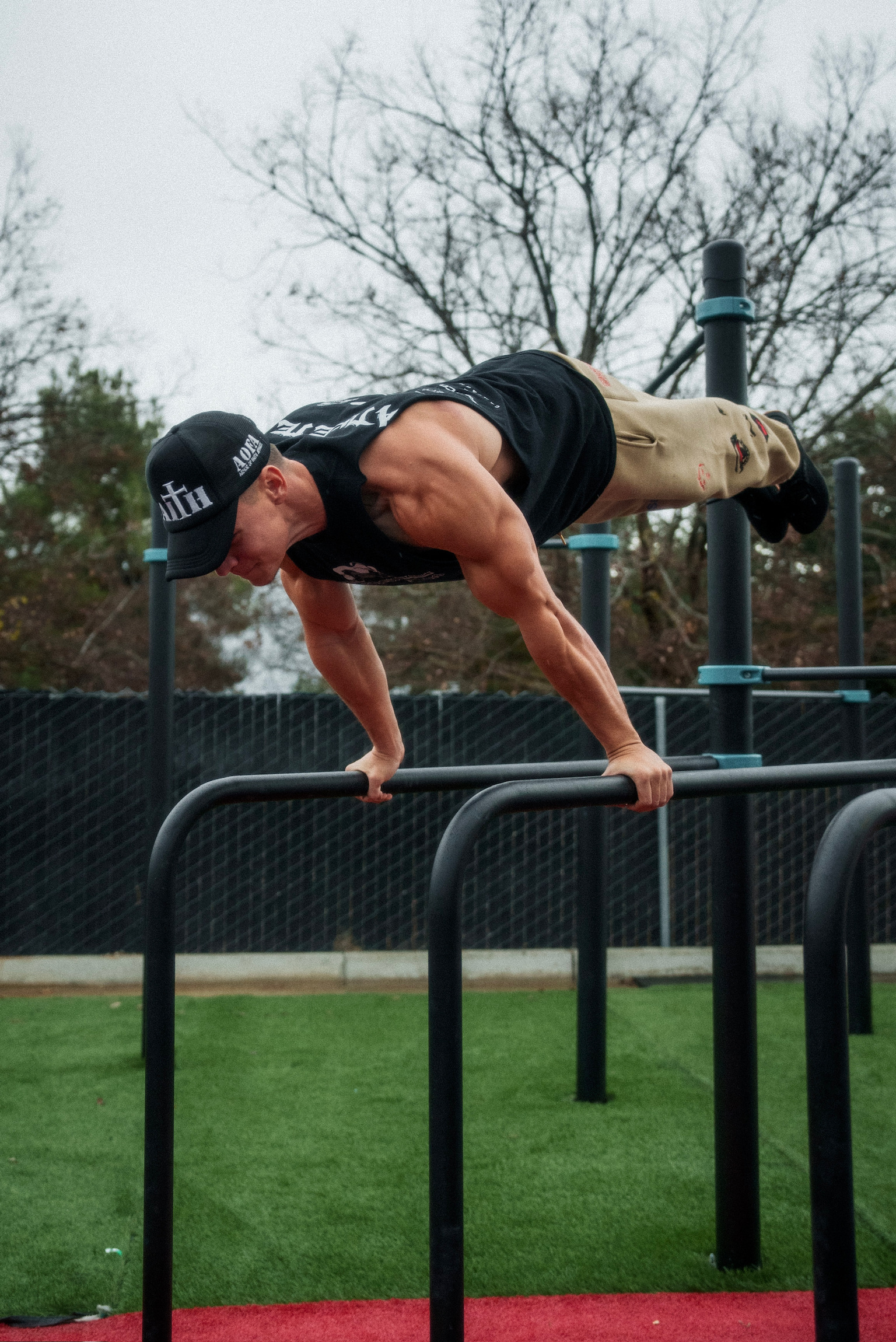 Muscular athlete doing pull ups calisthenics workout