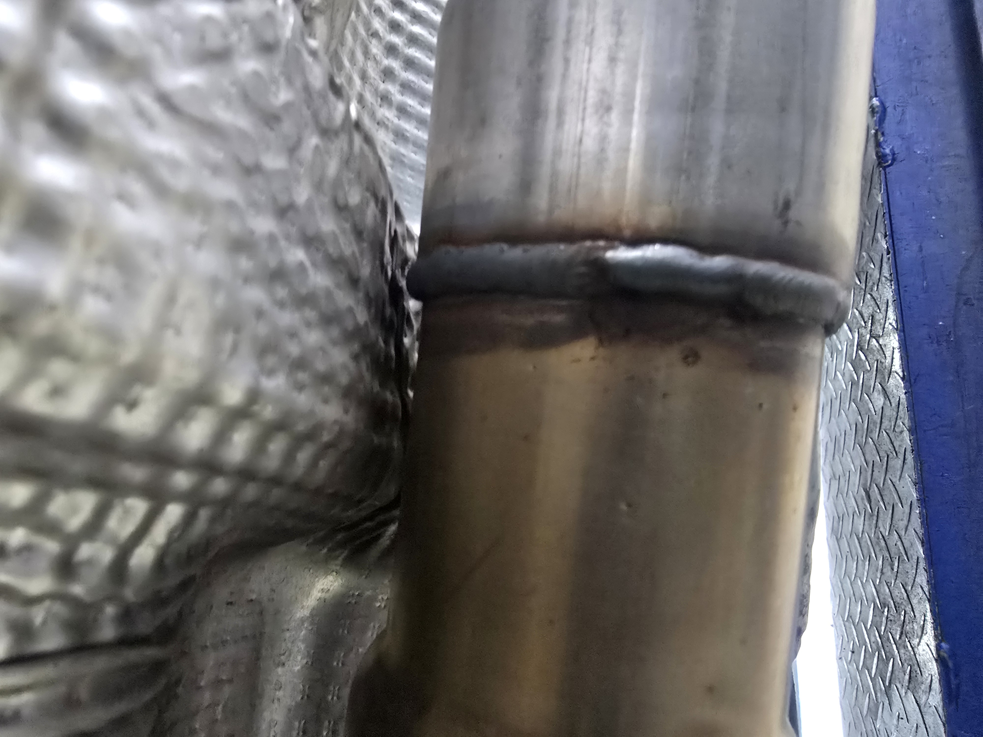 Skilled mechanic replacing water pump and timing belt on customer sedan