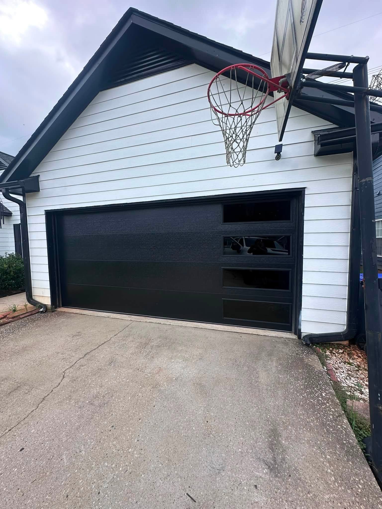 Contemporary black garage door with side windows