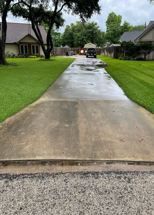 Split view showing a dirty concrete driveway before and perfectly clean after power washing in Victoria Texas