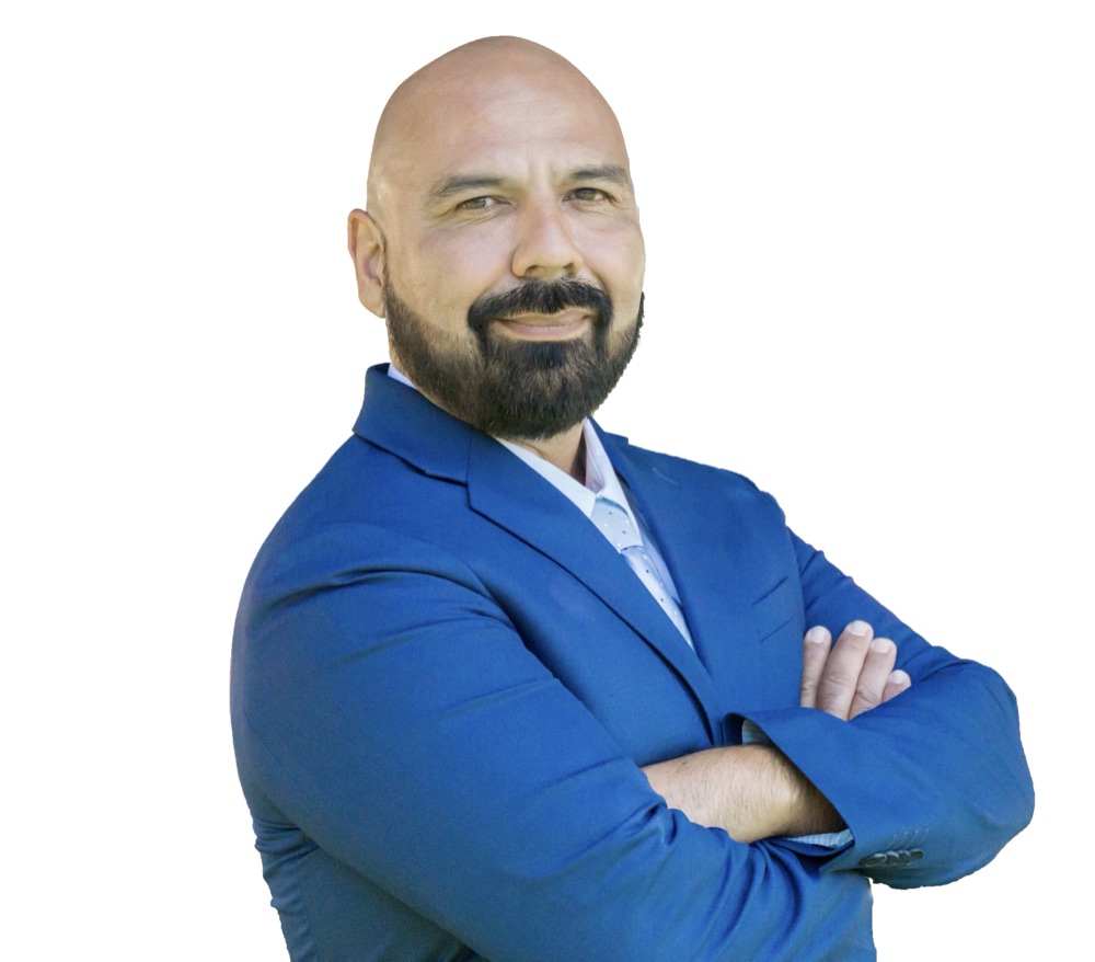 Jose Estrada, senior real estate advisor in San Diego specializing in senior transitions and downsizing, portrait with warm smile.