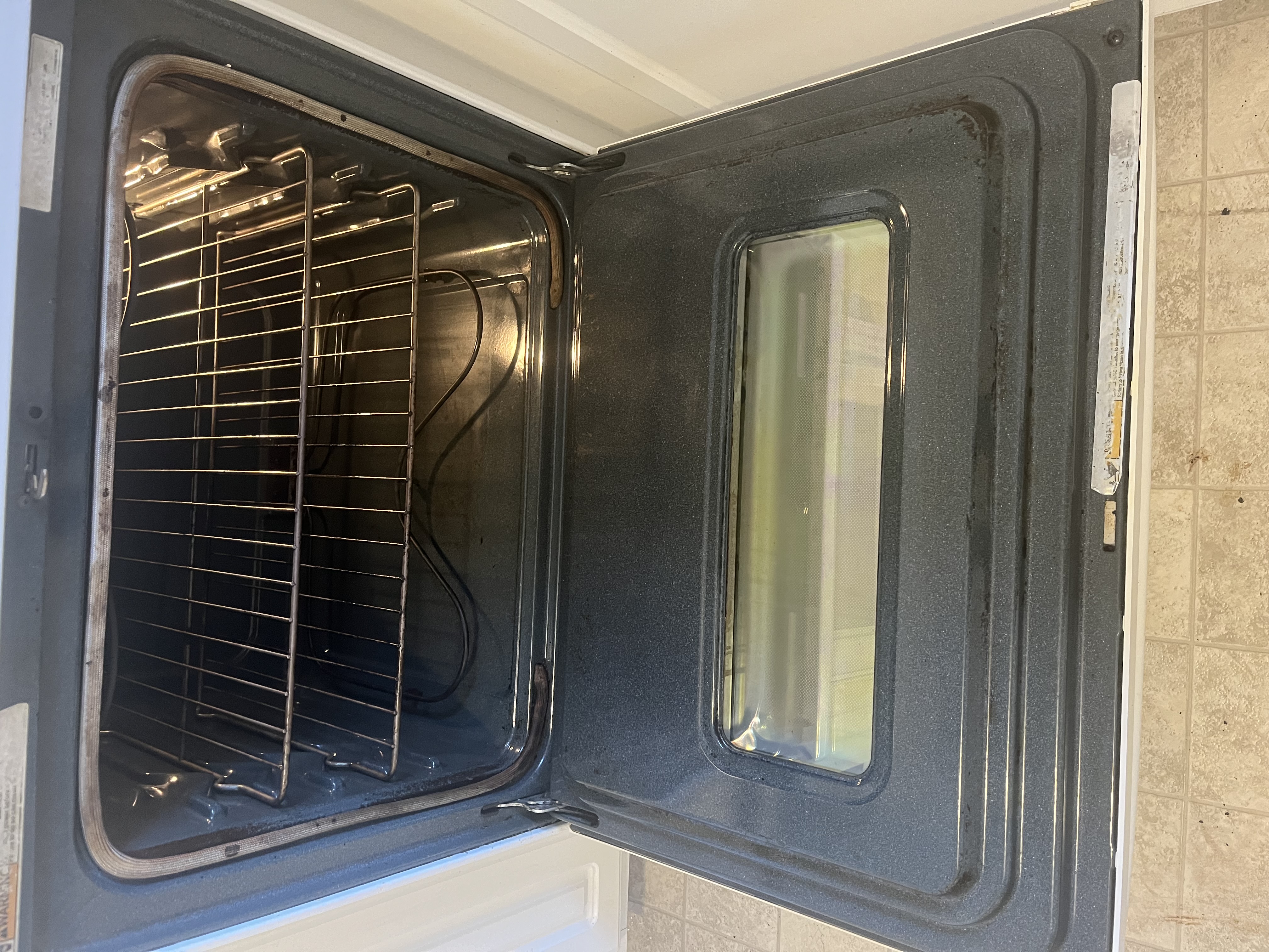 Sparkling clean kitchen with gleaming stovetop and spotless counters after professional cleaning