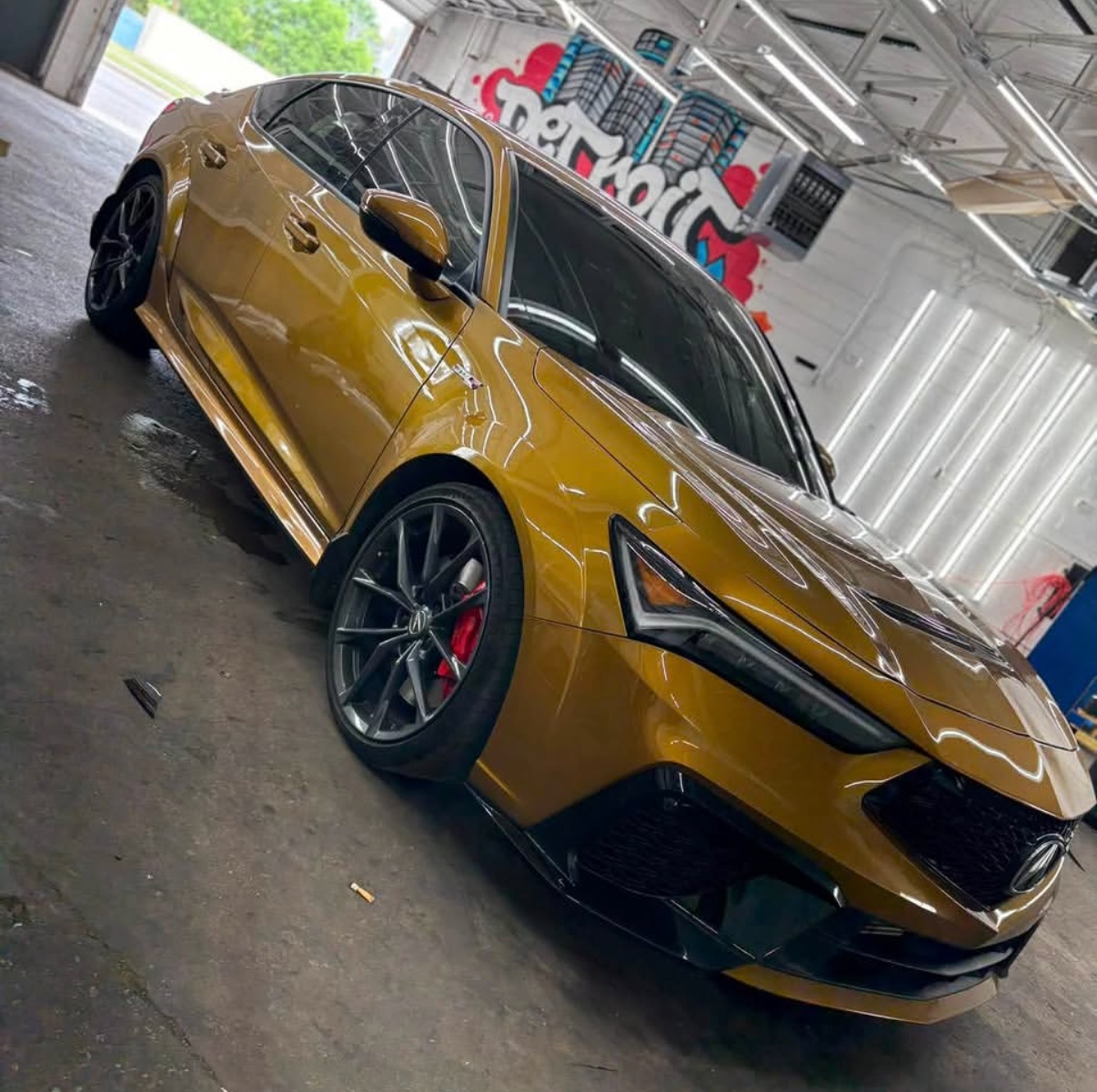 Sleek black sports car featuring flawless premium ceramic window tint applied by Detroit Tint professionals