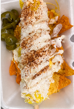 Grilled Mexican street corn elote on the cob with mayo cotija cheese chili and lime