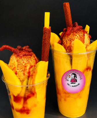 Refreshing mangonada with fresh mango chunks chamoy sauce and tajin rim