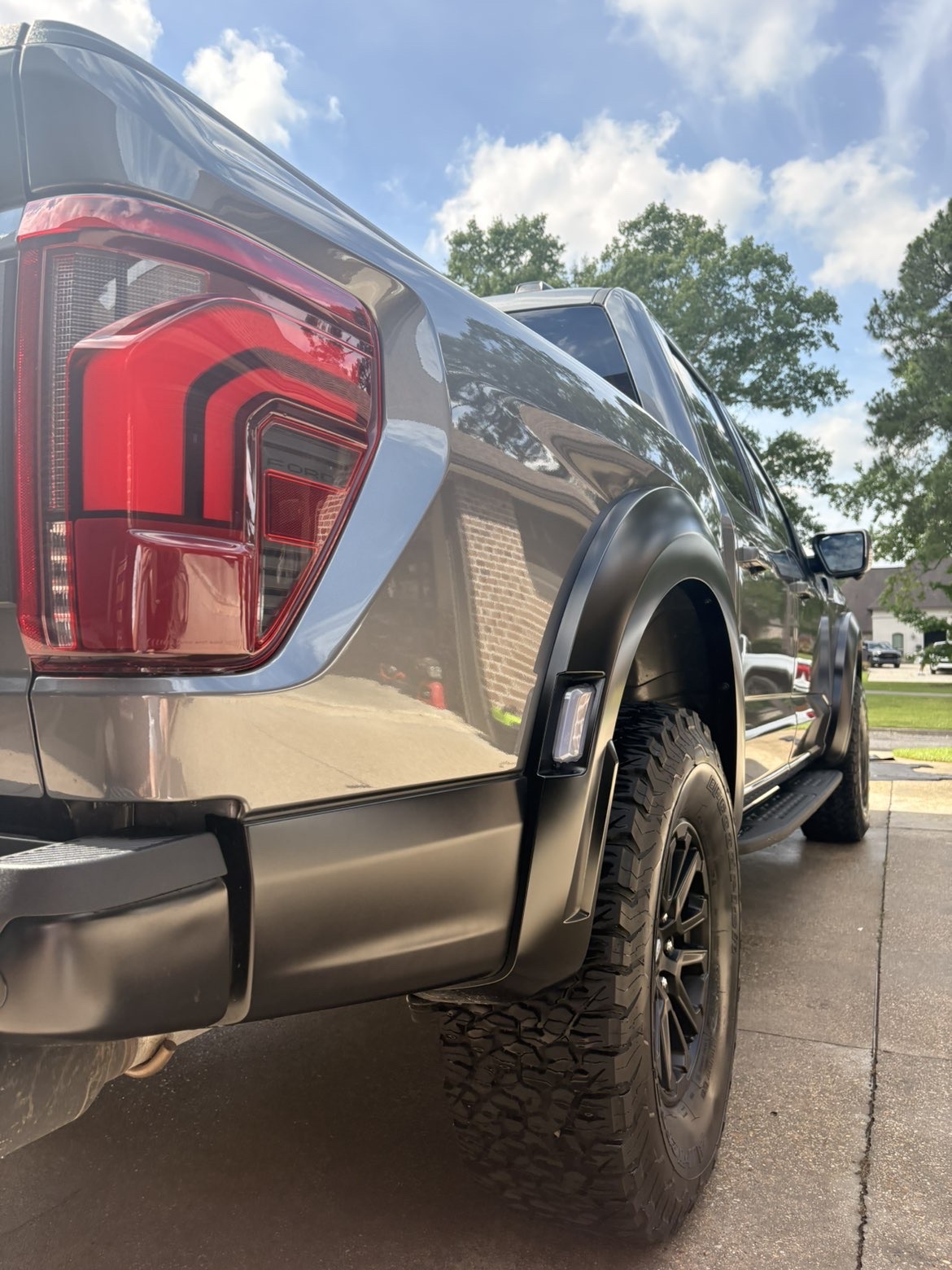 Highly glossy freshly detailed luxury car showcasing mirror-like paint finish