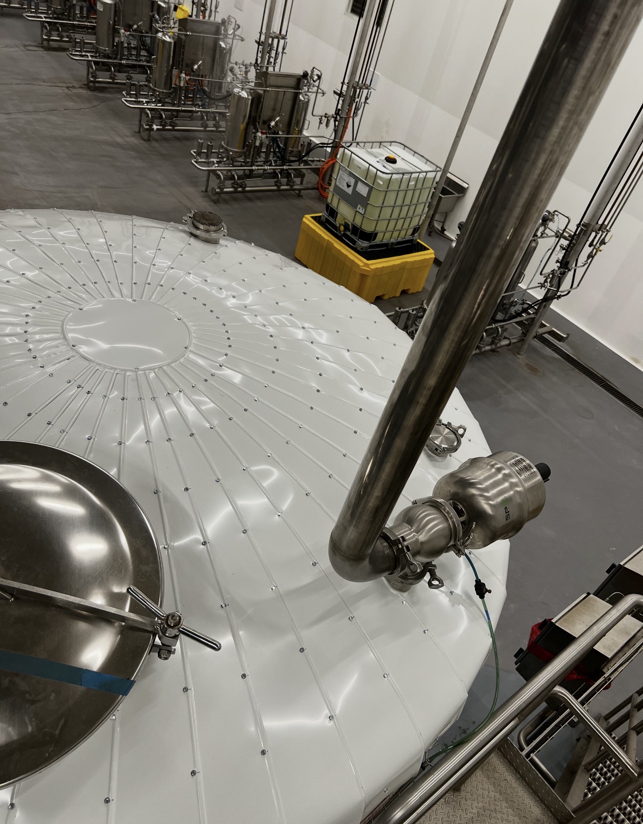 A complex boiler room with all steam lines and components meticulously insulated to improve safety and efficiency.