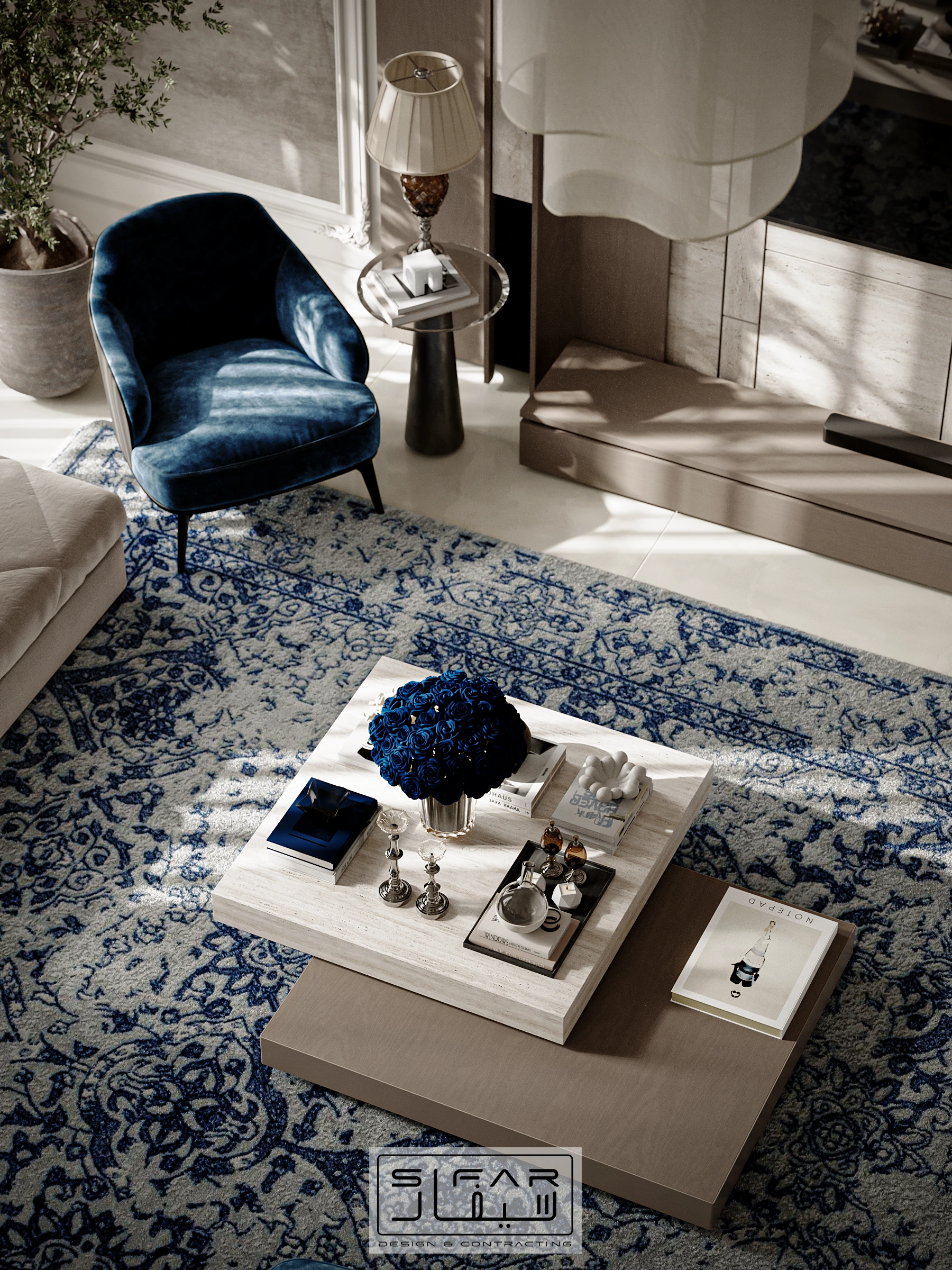 Family living room detail with blue velvet accent chair, patterned rug, sculptural coffee table, and natural light