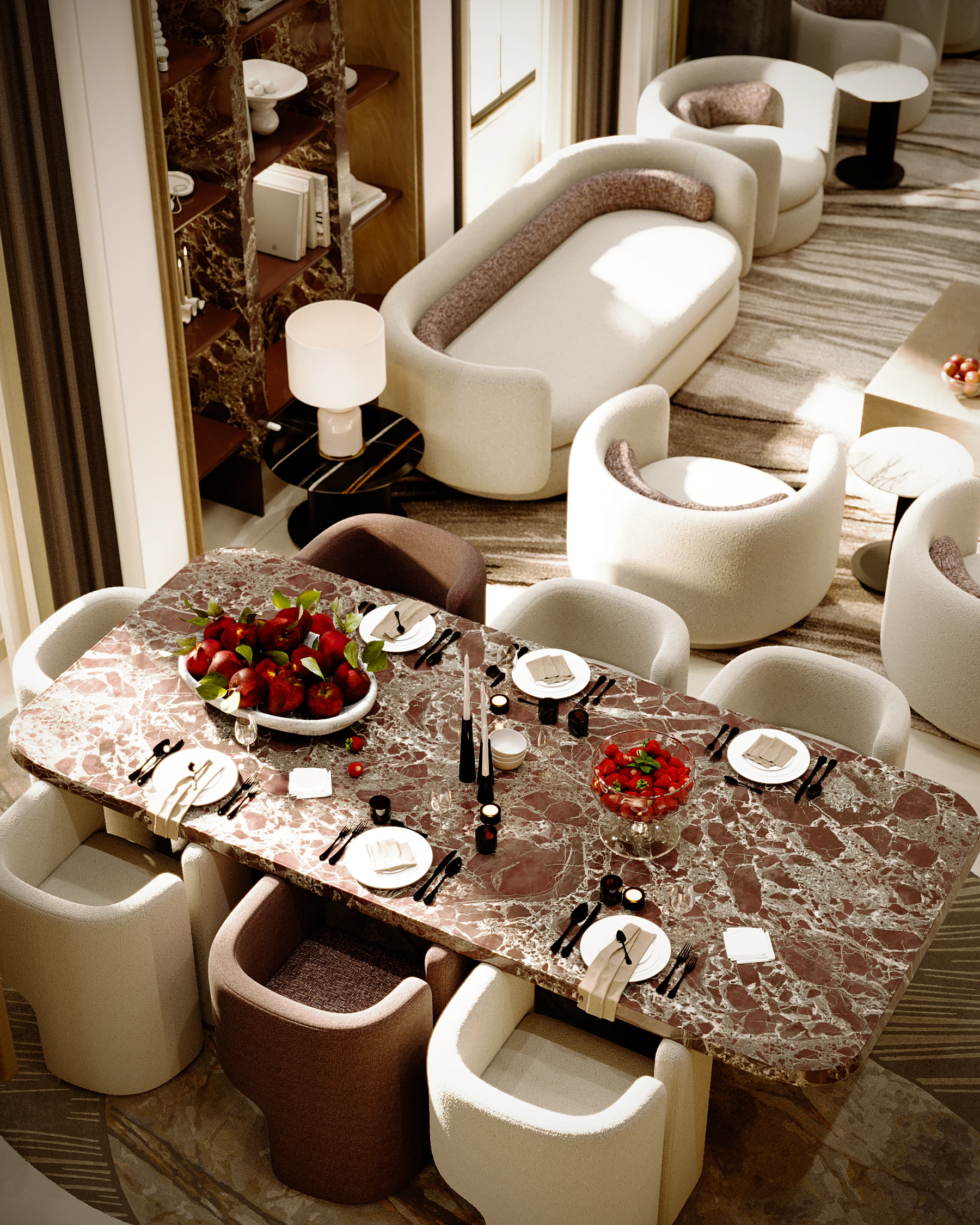 Majlis Amina dining detail with stone dining table, upholstered chairs, fruit styling, and connected lounge seating beyond