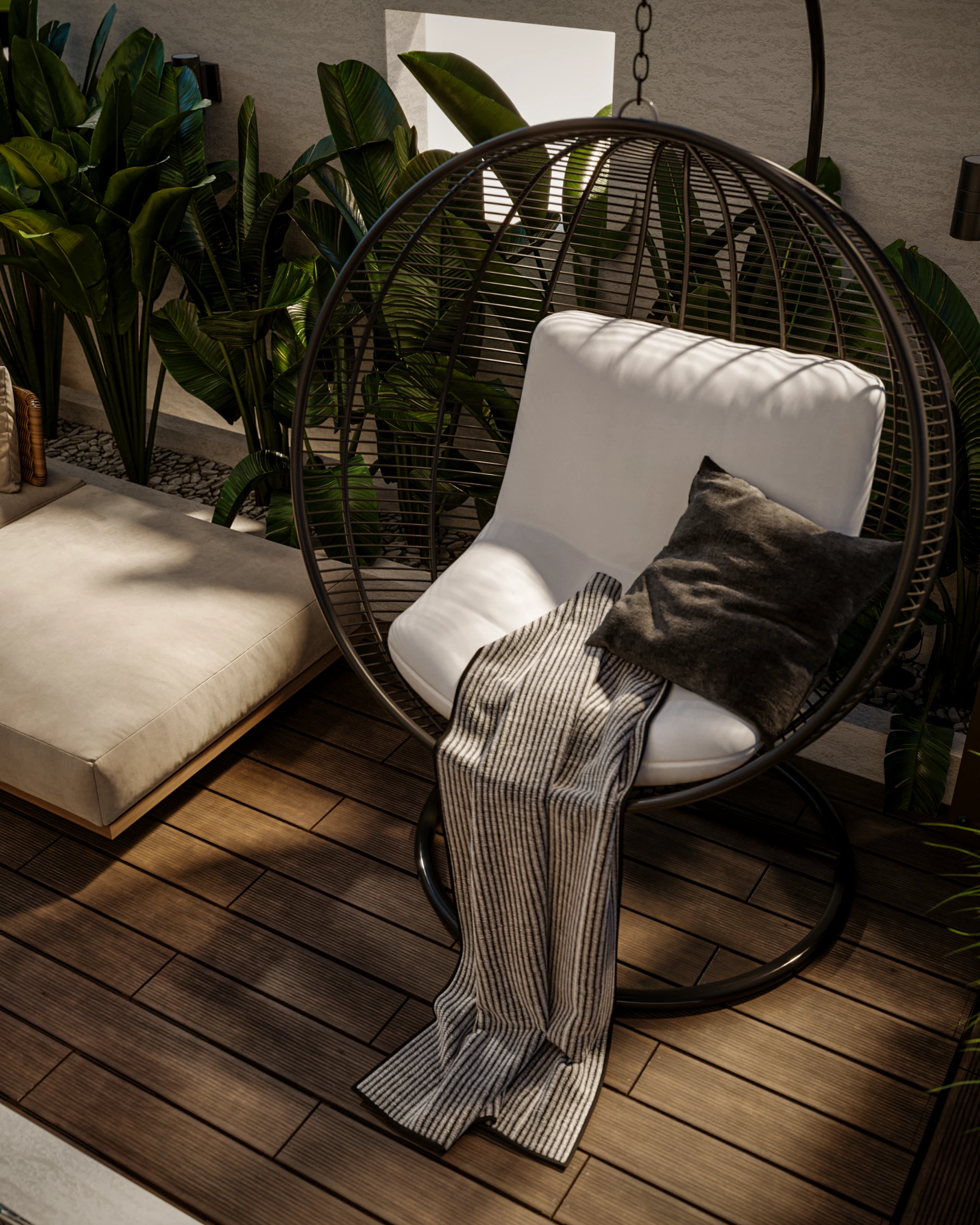 Outdoor hanging chair detail with striped throw, neutral cushion, timber decking, and tropical planting