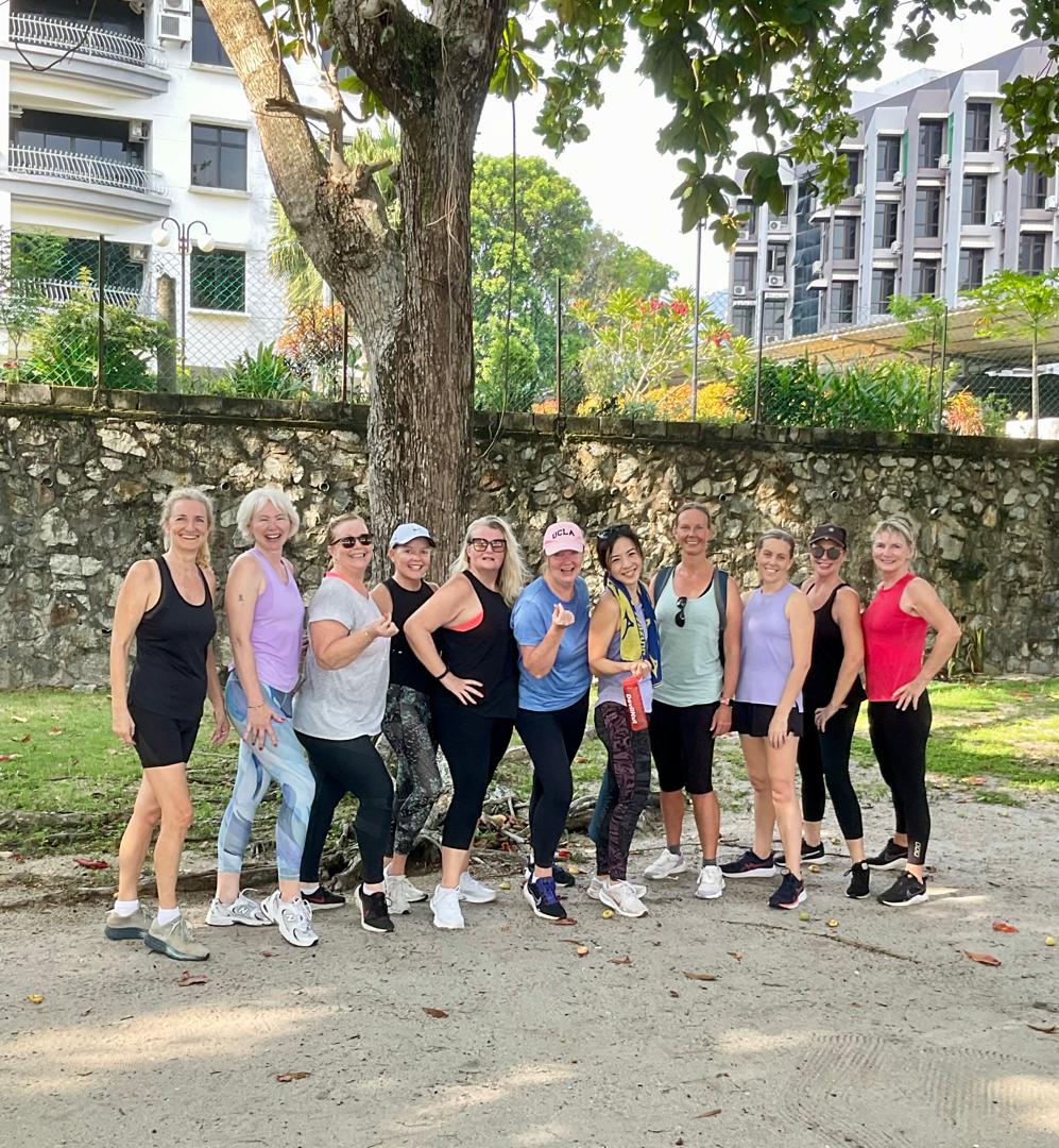 Women's post-workout stretching and cool down session outdoors
