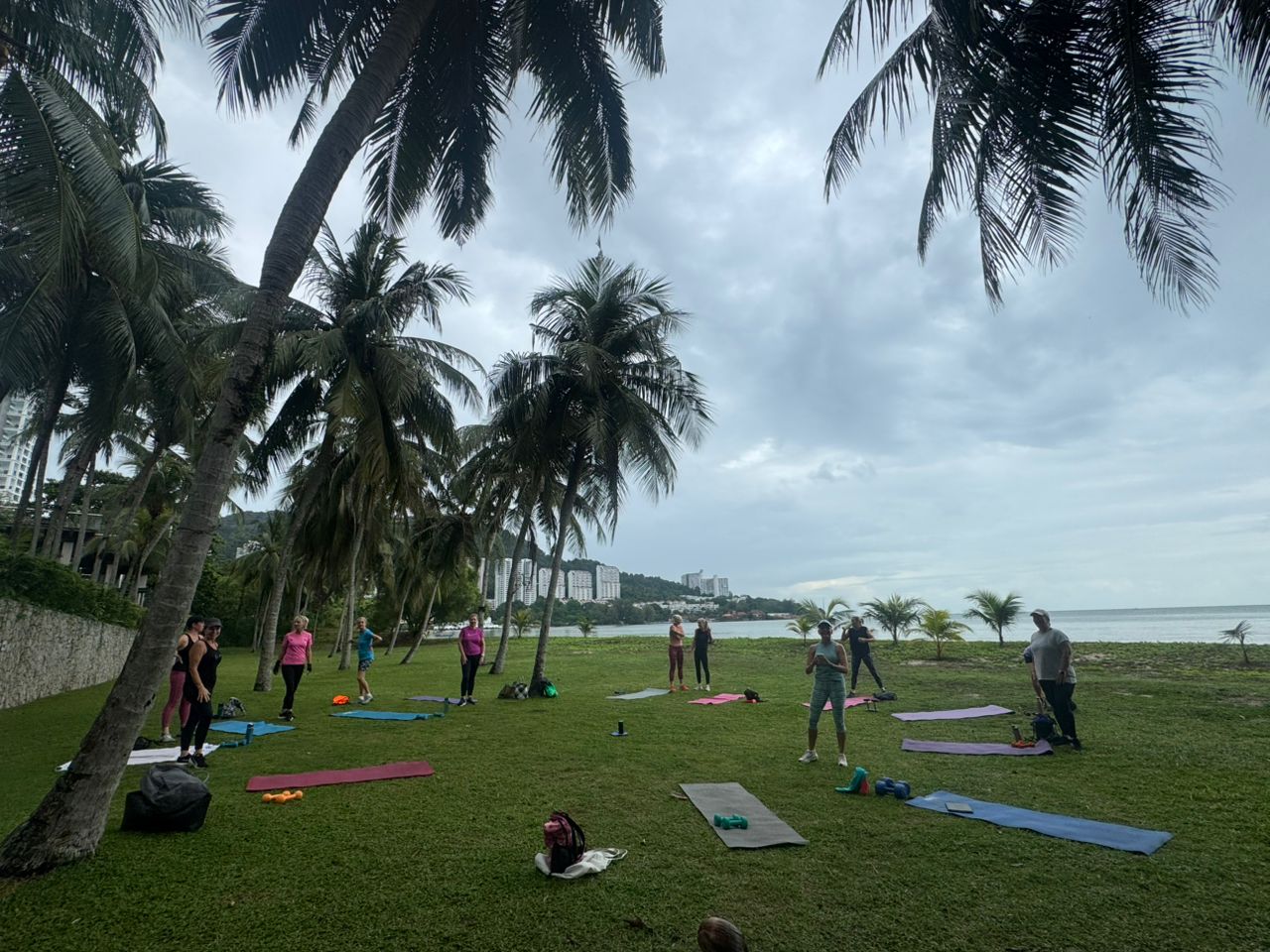 Women celebrating with high fives after completing Tabata workout in Penang