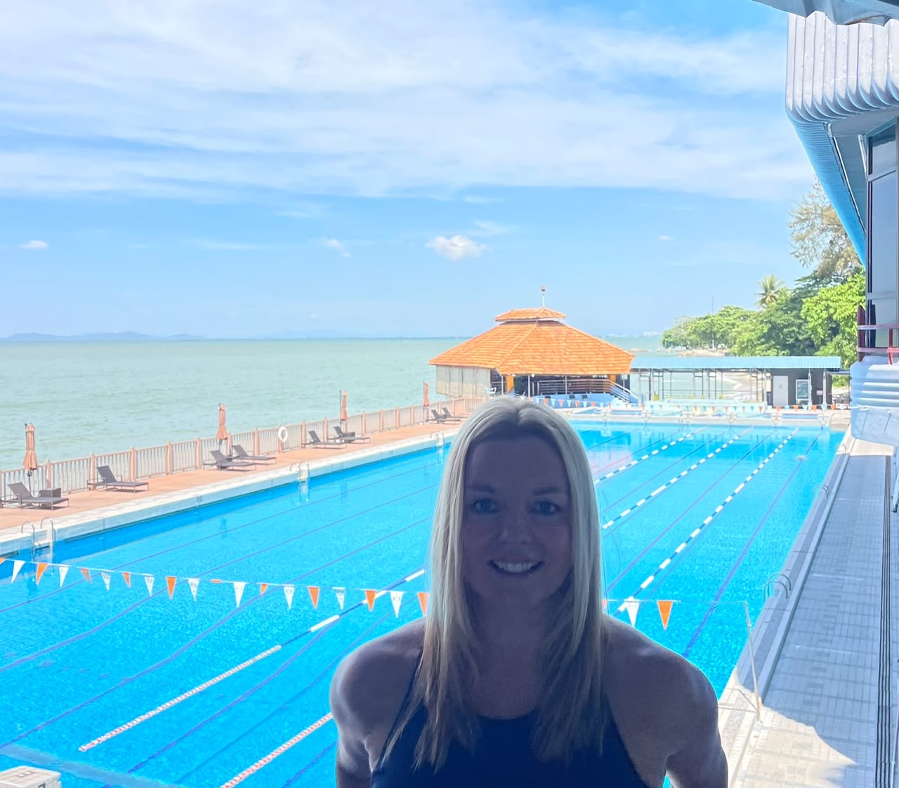 Professional portrait of ACE certified fitness coach Gillian in athletic wear at outdoor training location in Penang