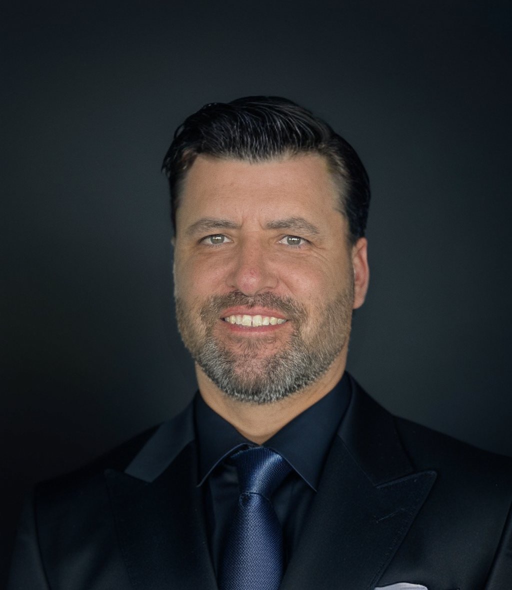 Aaron Luque, professional golf instructor, in a modern coaching facility